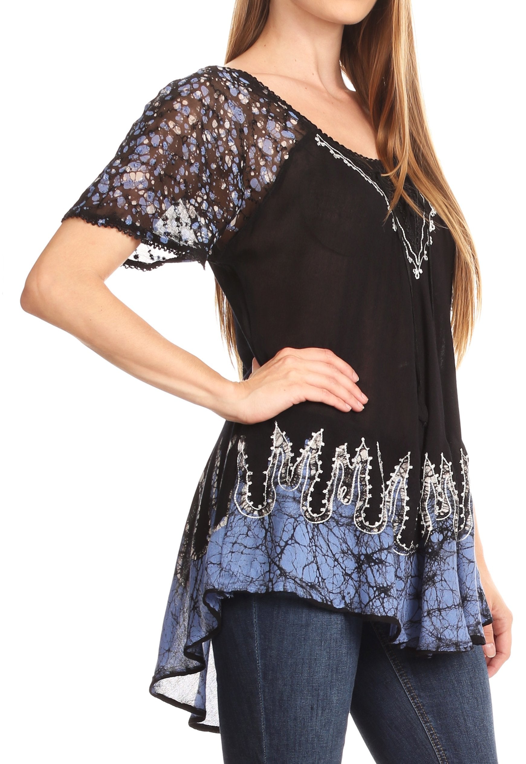 Black and blue patterned top worn by a model on a white background