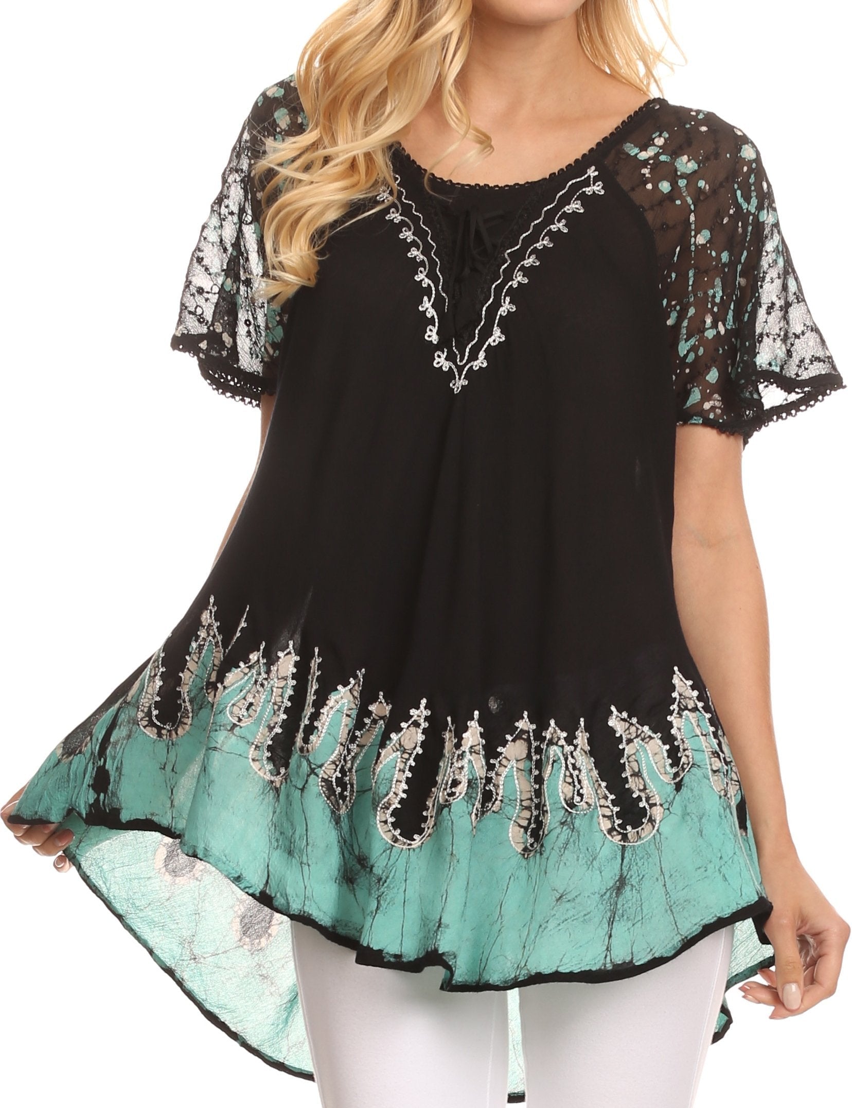 Black and teal lace top worn by a model on a white background