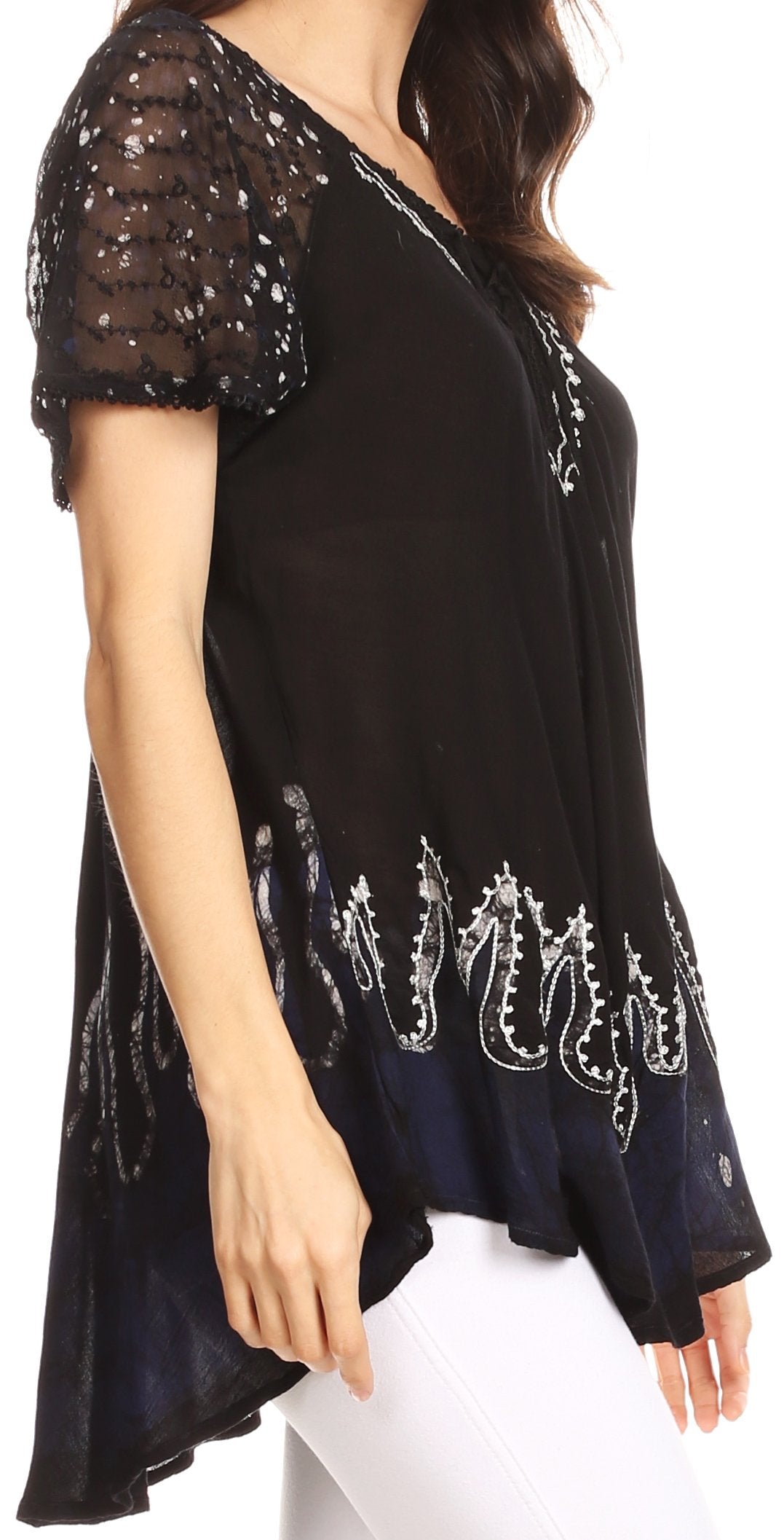 Black top with white embroidery on a white background