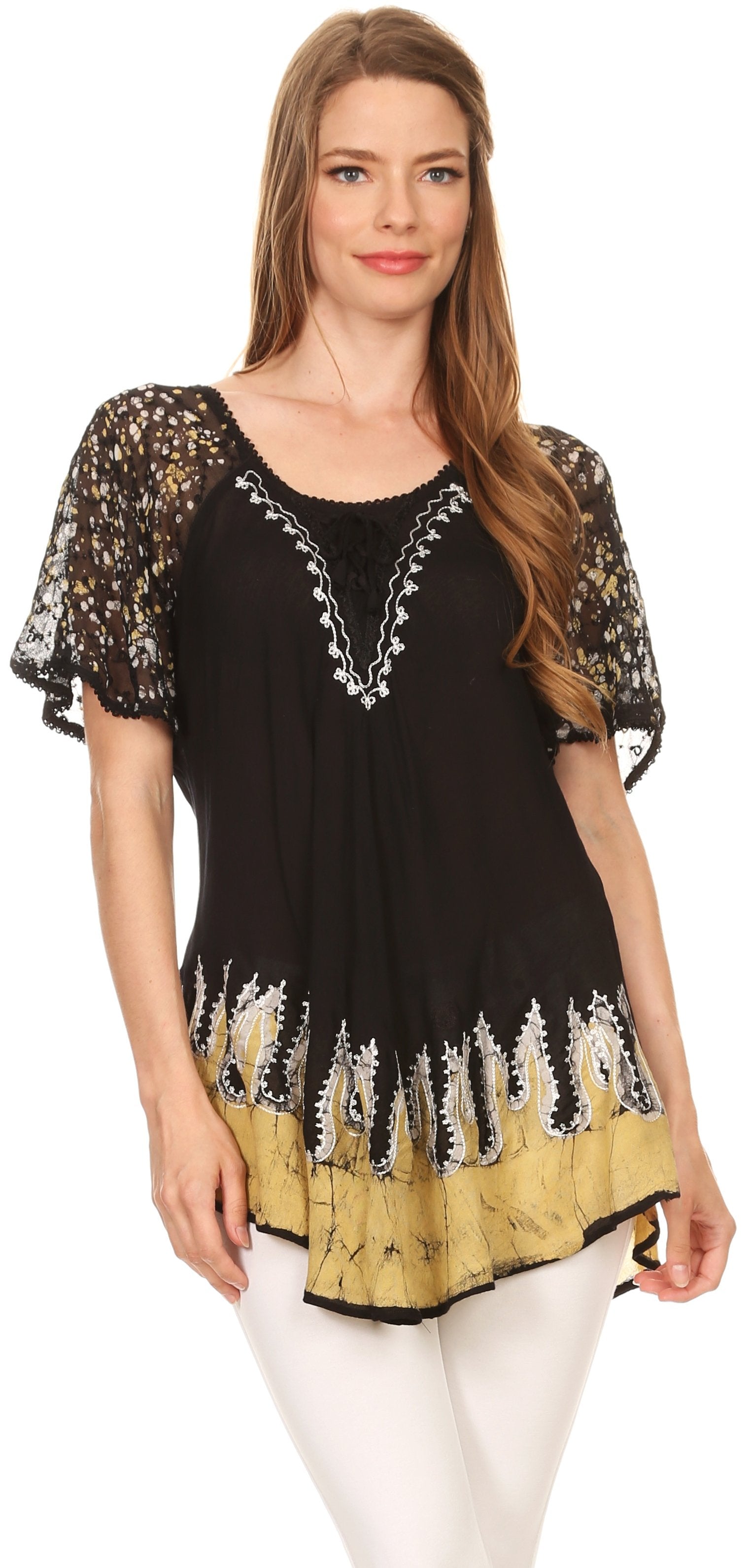 Woman wearing a black and yellow patterned top on a white background