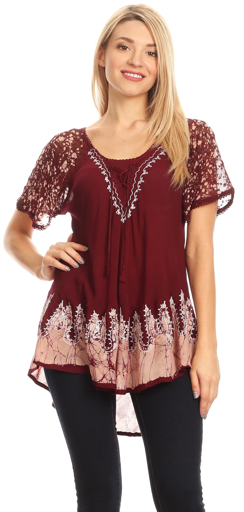 Woman wearing a burgundy lace top with a white background