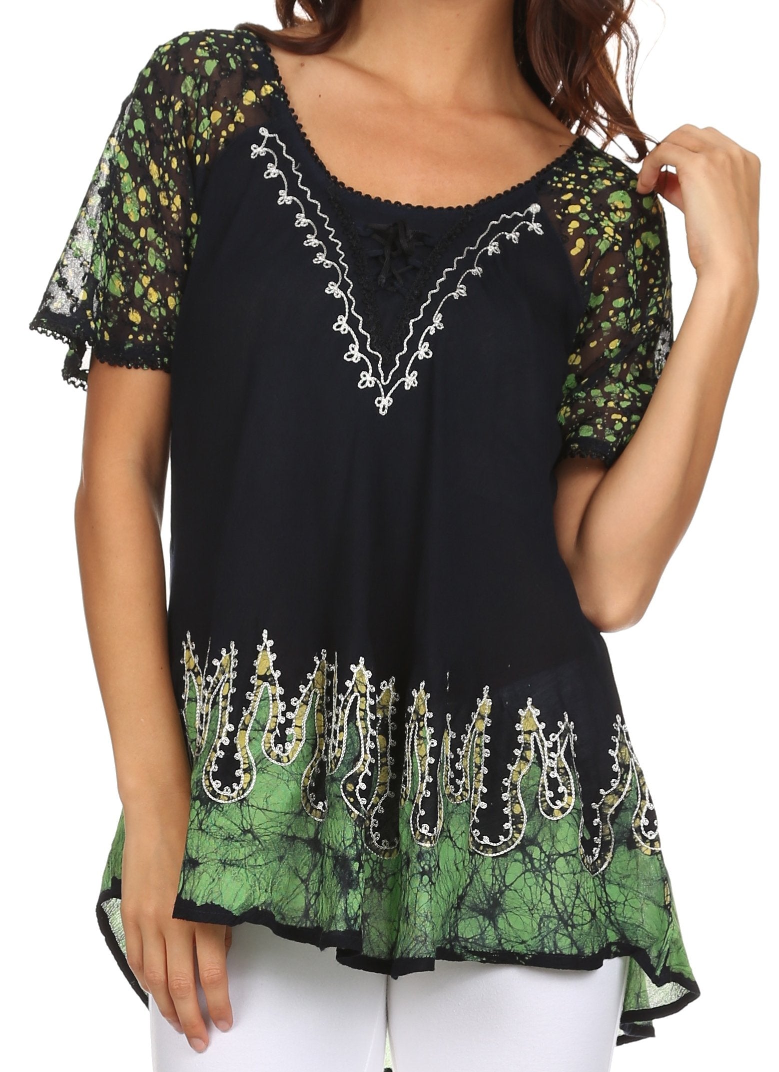Black and green embroidered top worn by a model on a white background