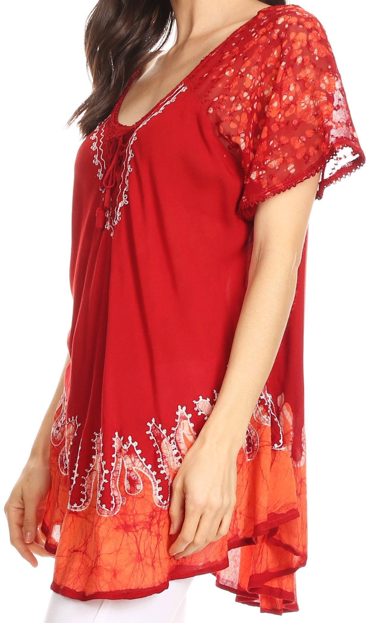 Red embroidered dress with white patterns on a plain background