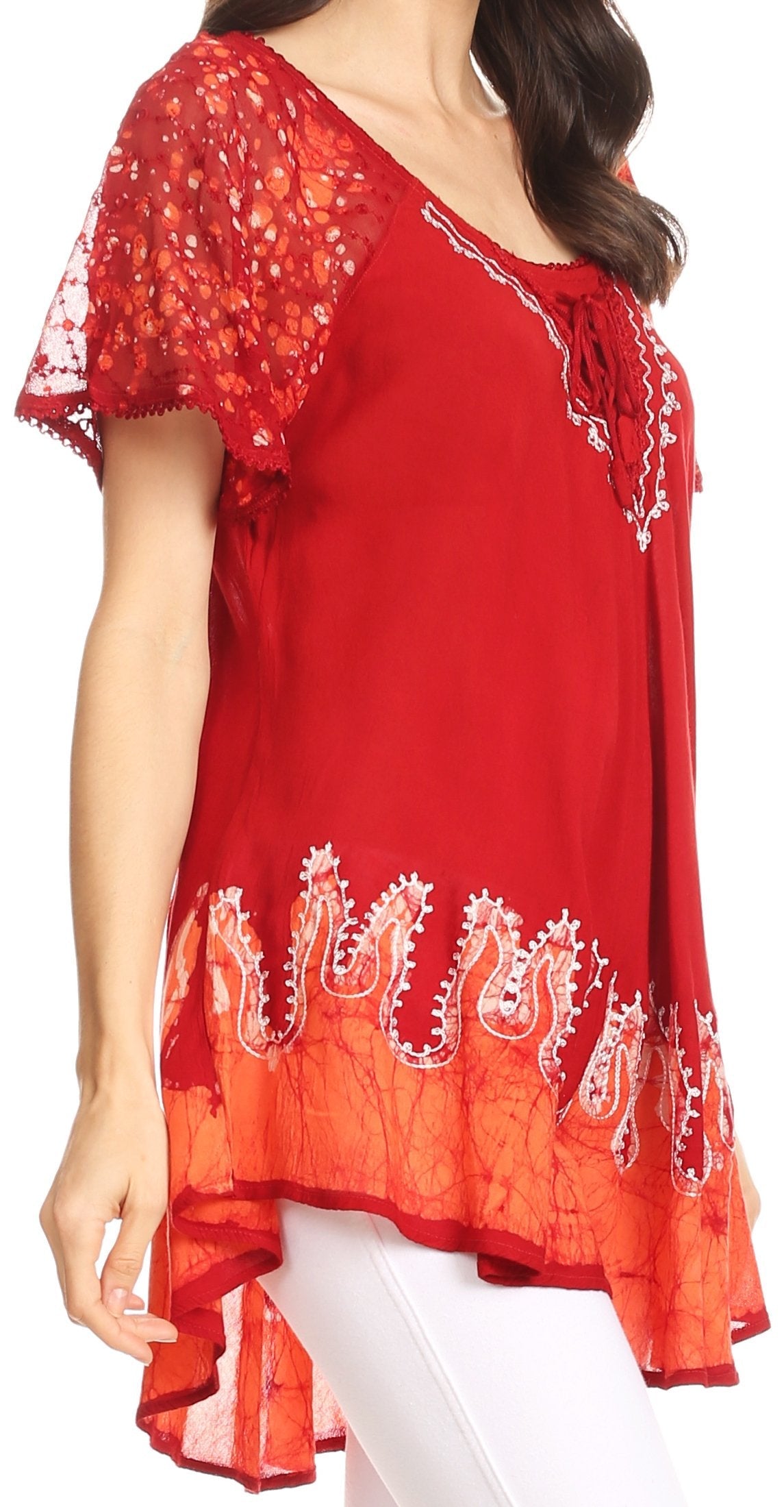 Red embroidered top worn by a model on a white background