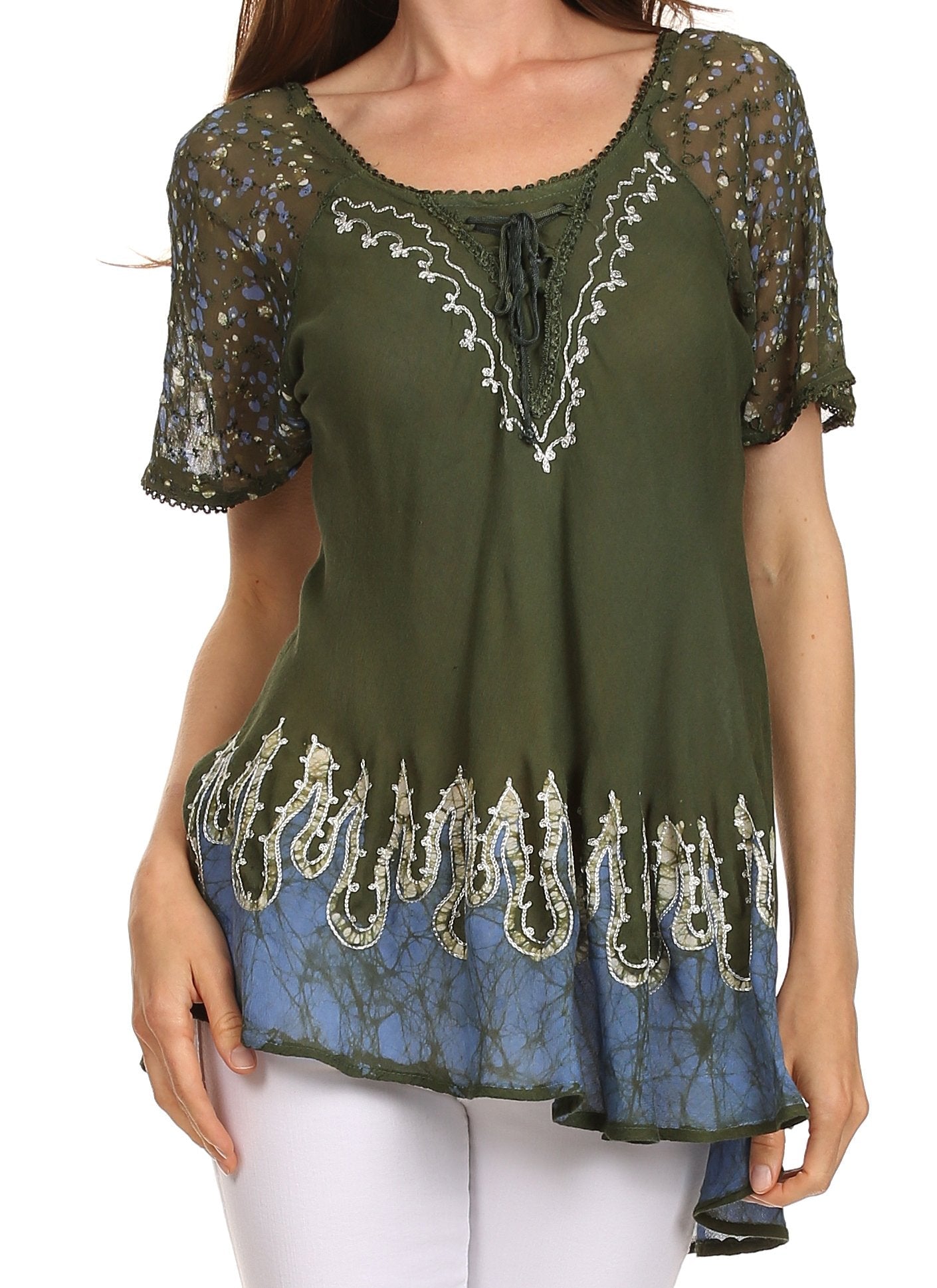 Green and blue embroidered top worn by a person on a white background