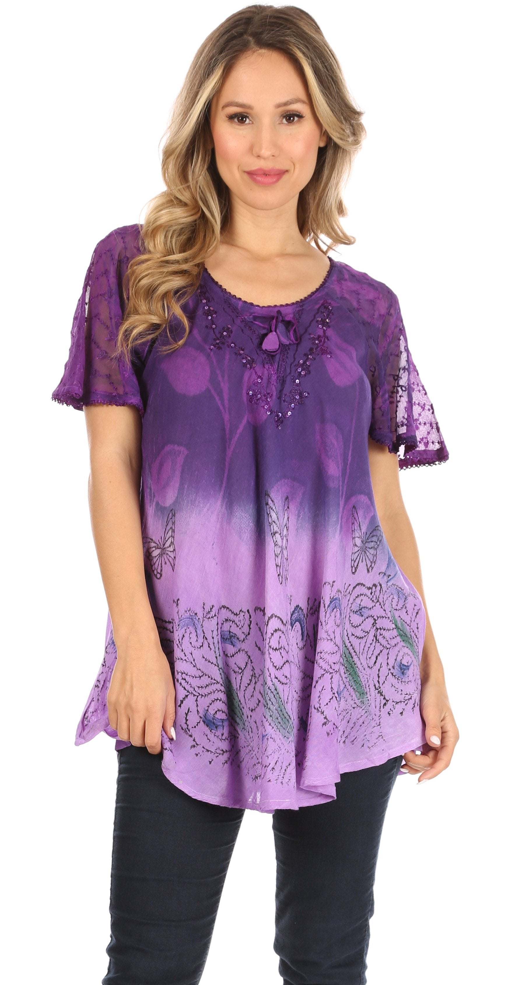 Woman wearing a purple patterned top on a white background