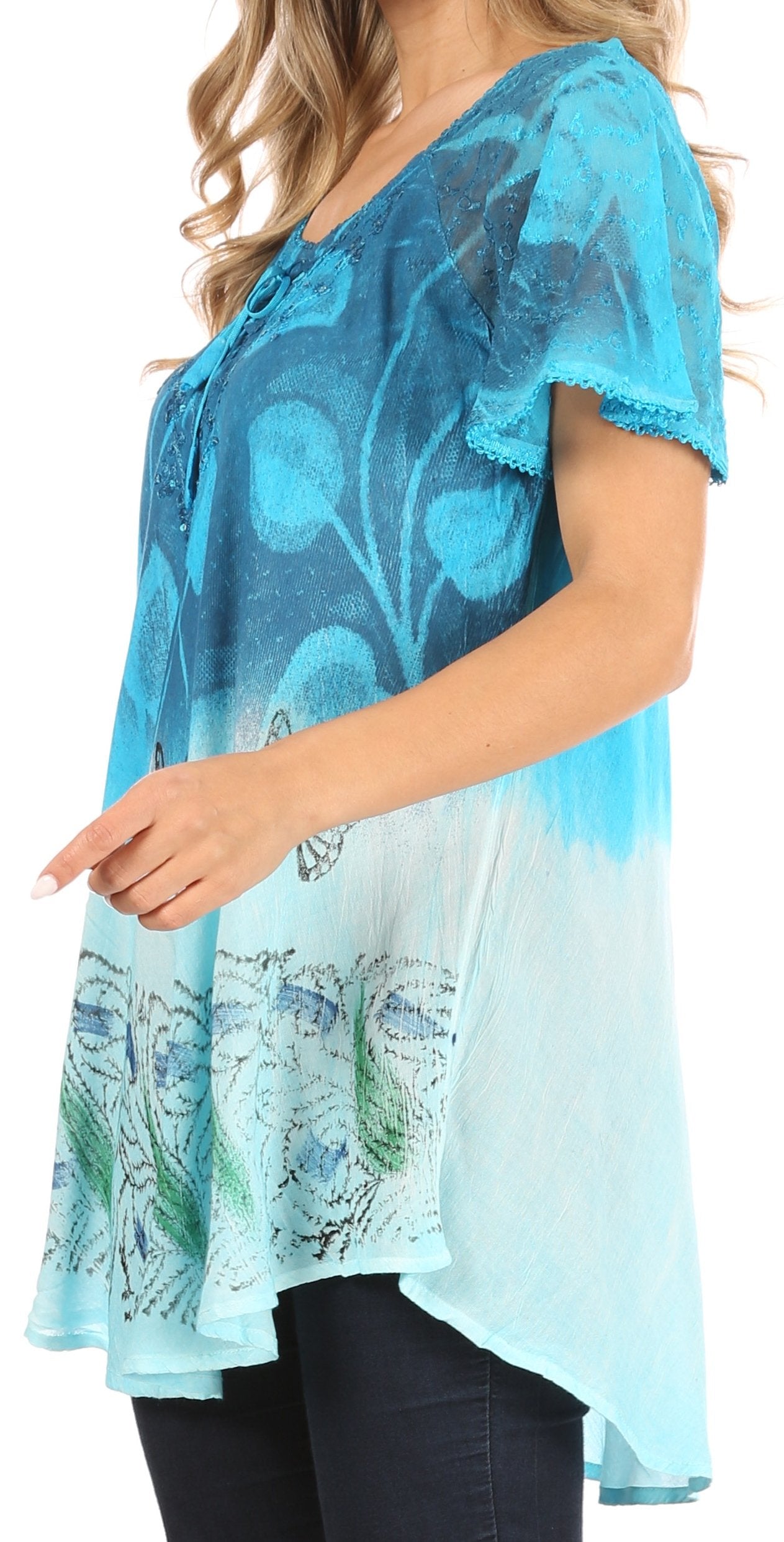 Woman wearing a blue floral patterned top on a white background