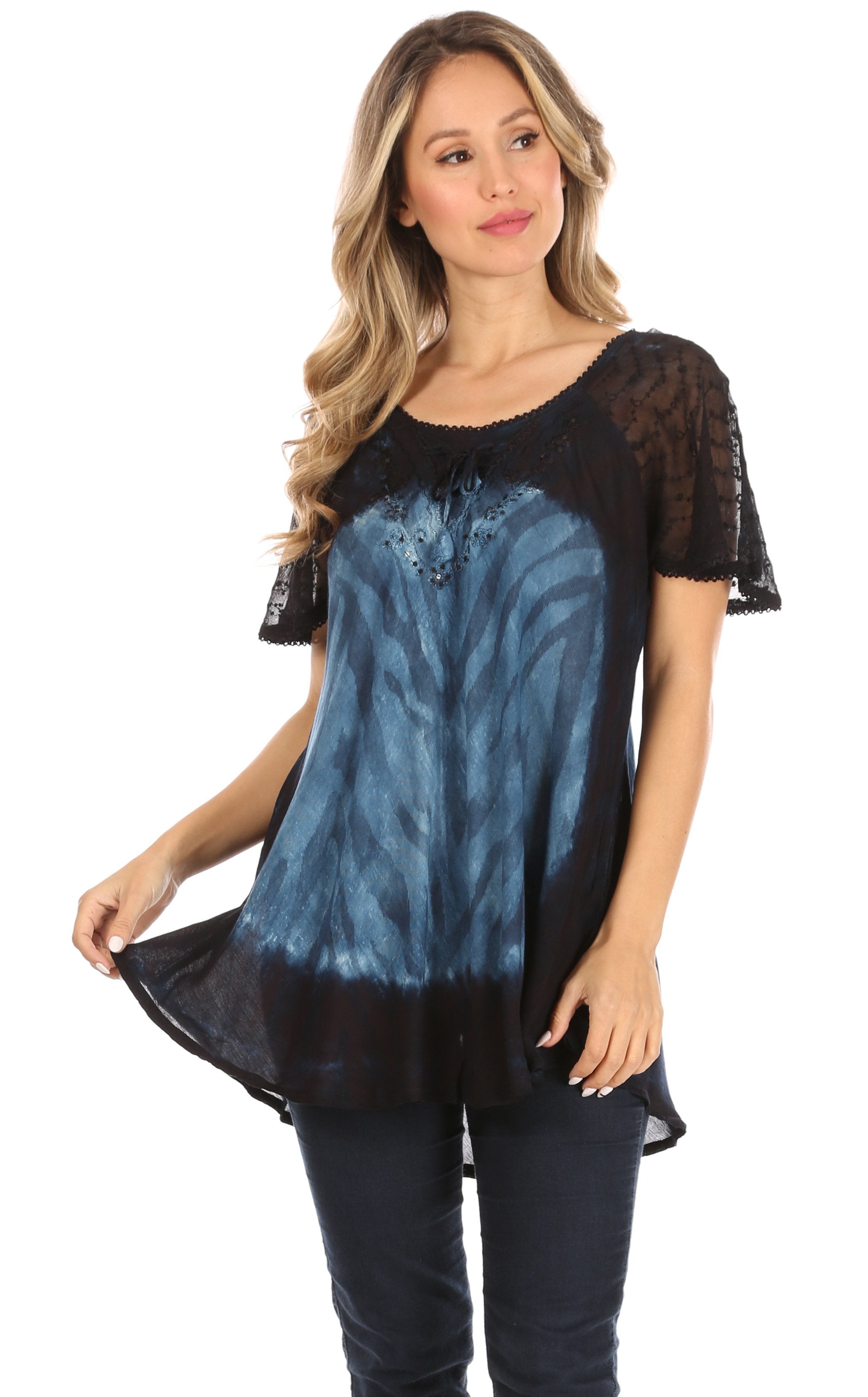 Woman wearing a black and blue patterned top on a white background