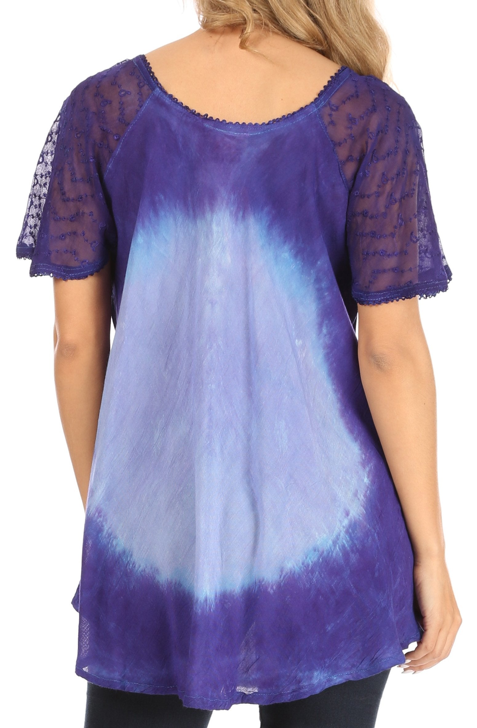 Woman wearing a blue and purple tie-dye top with sheer sleeves on a white background