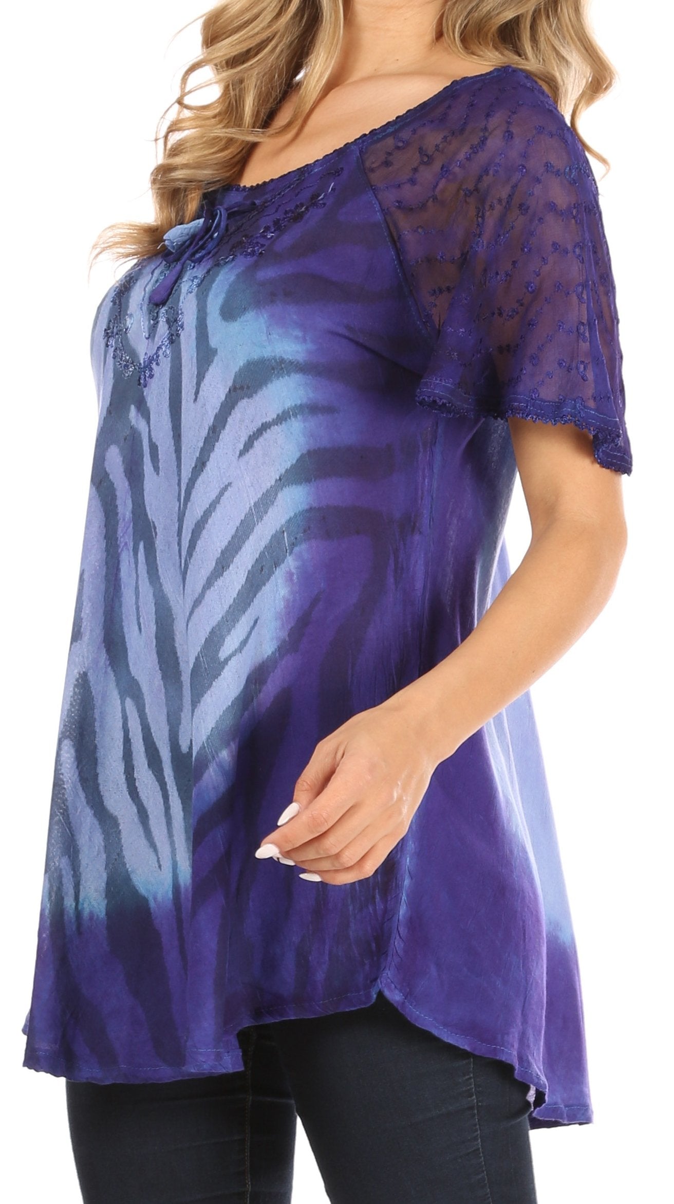 Purple tunic with zebra pattern and lace details worn by a model on a white background