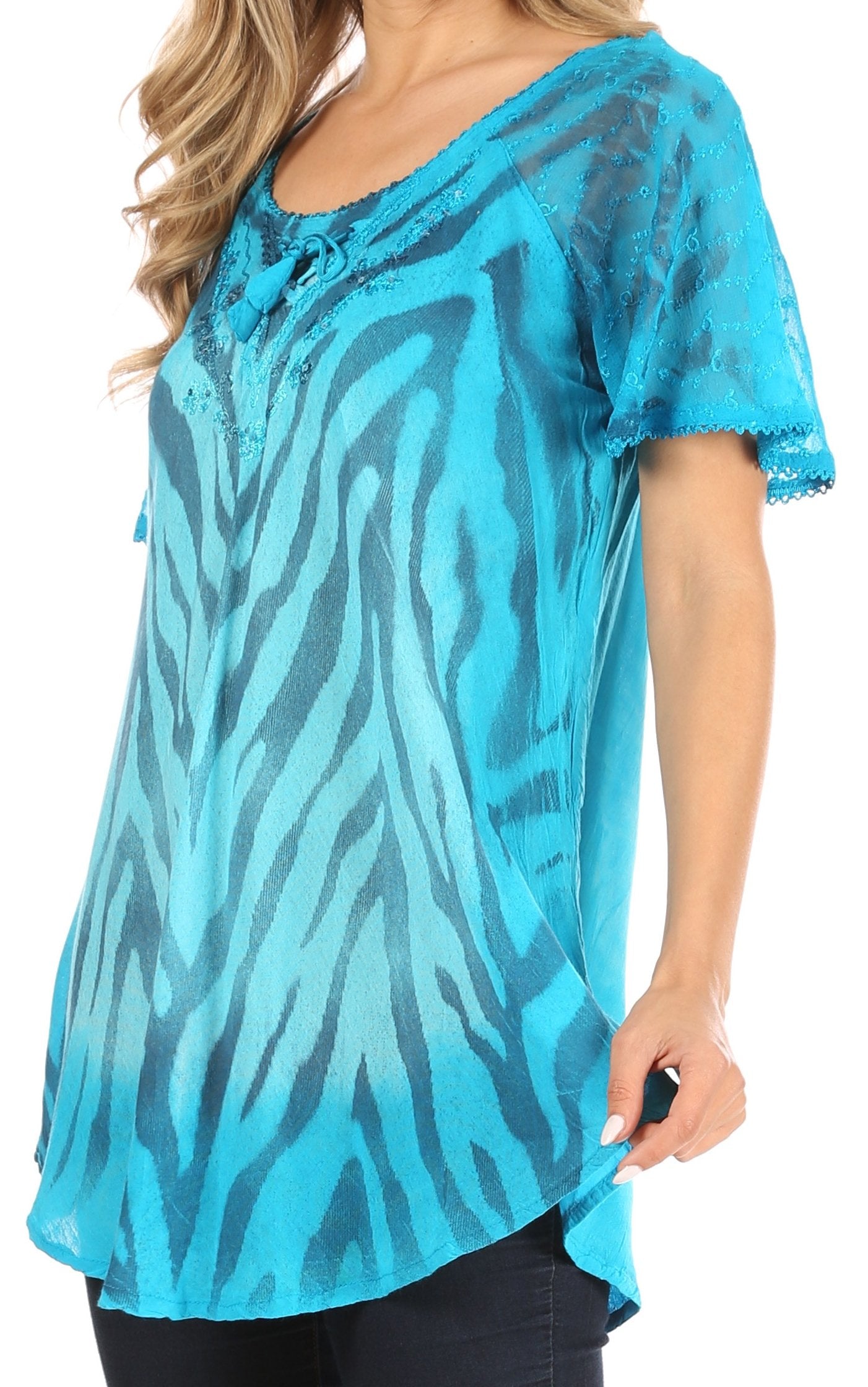 Blue zebra print tunic worn by a person on a white background