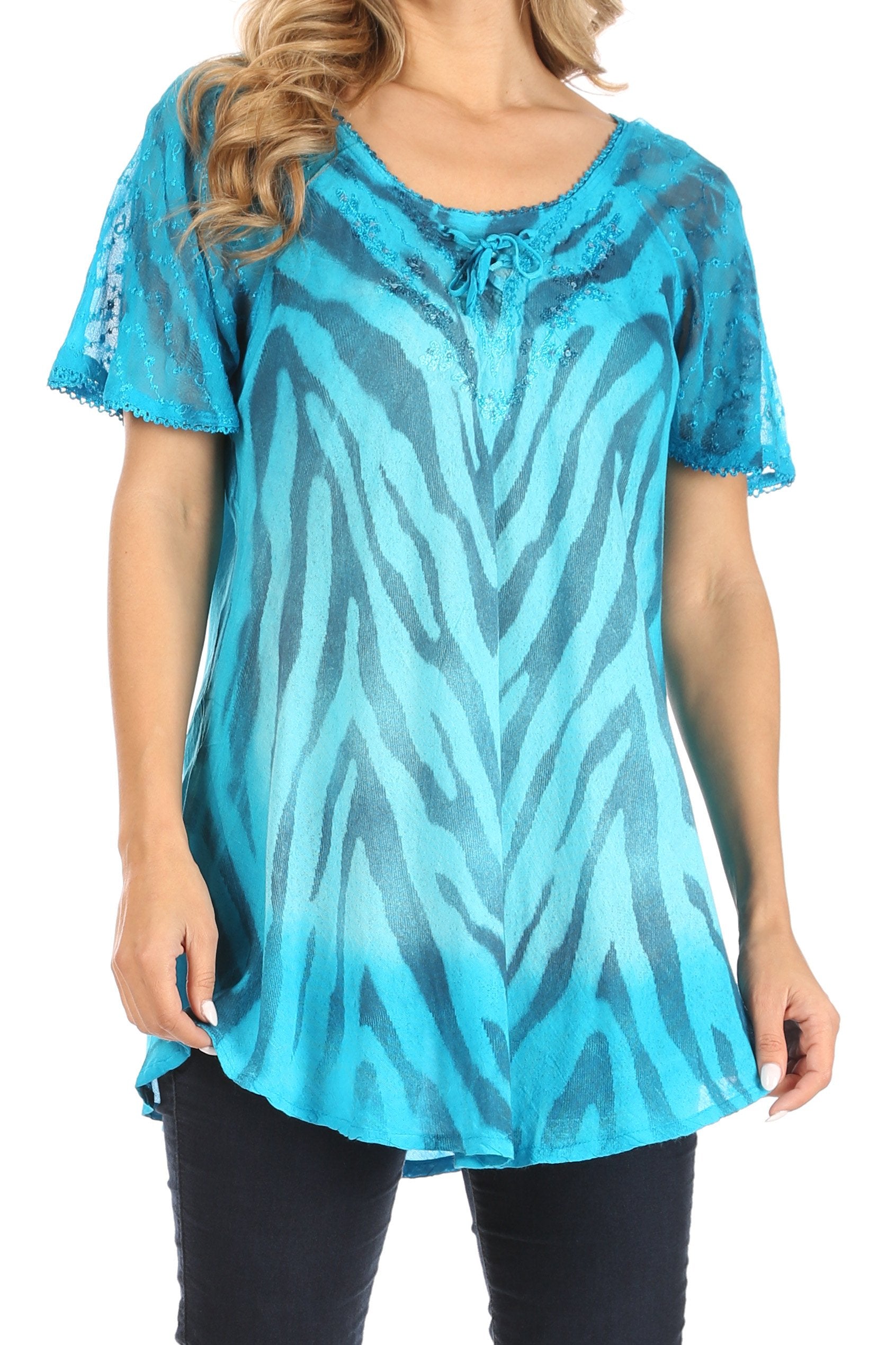 Blue zebra patterned top worn by a person on a white background