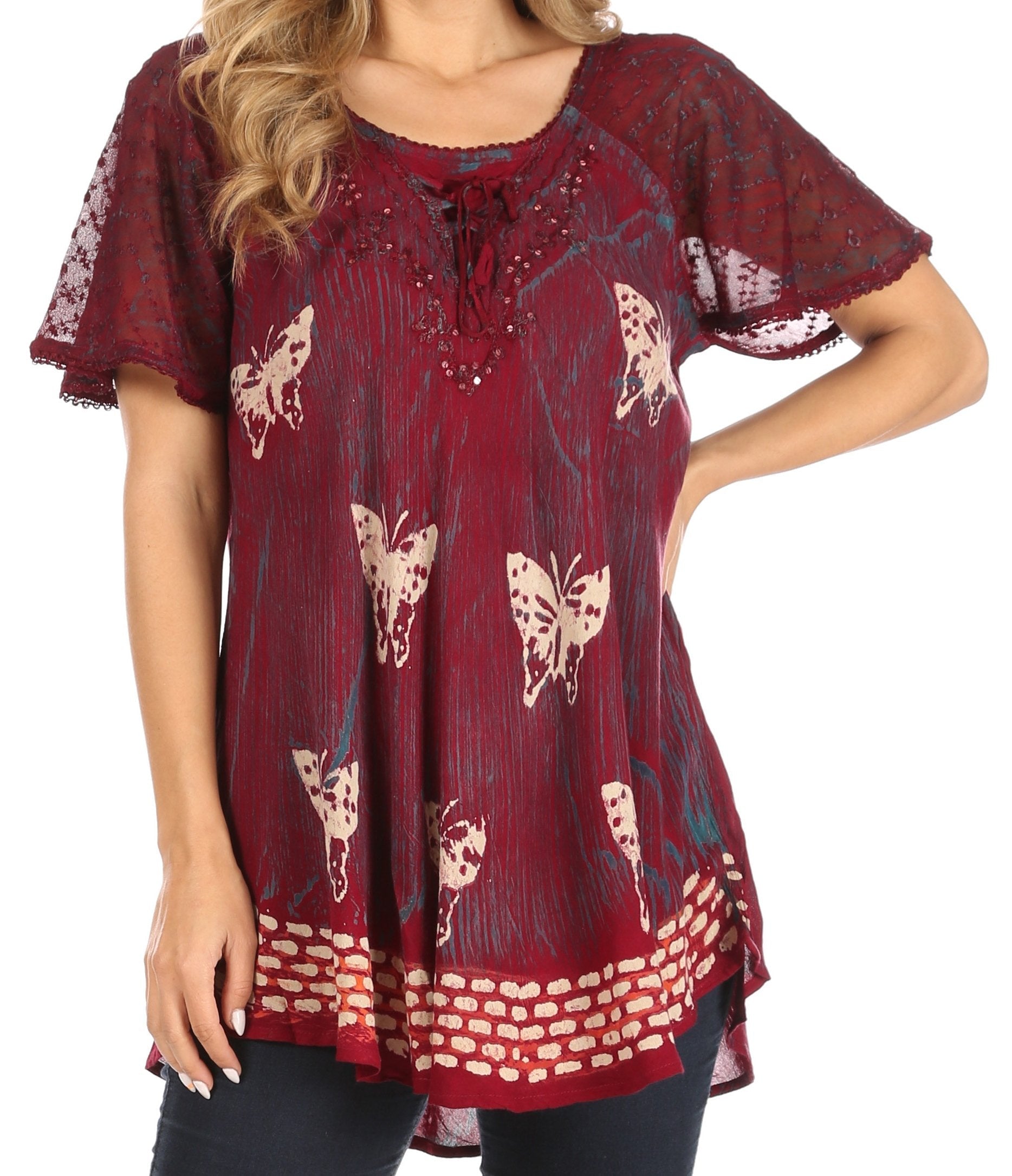 Red blouse with butterfly pattern worn by a person on a white background
