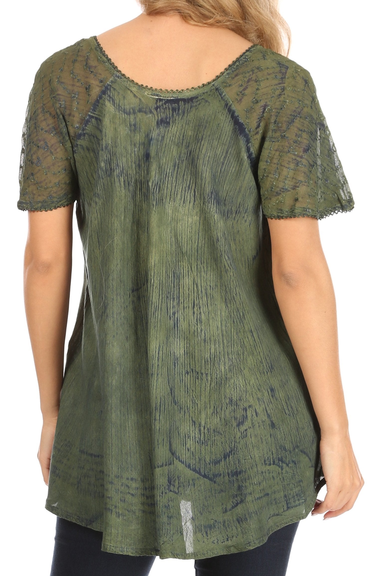Green patterned tunic worn by a person on a white background