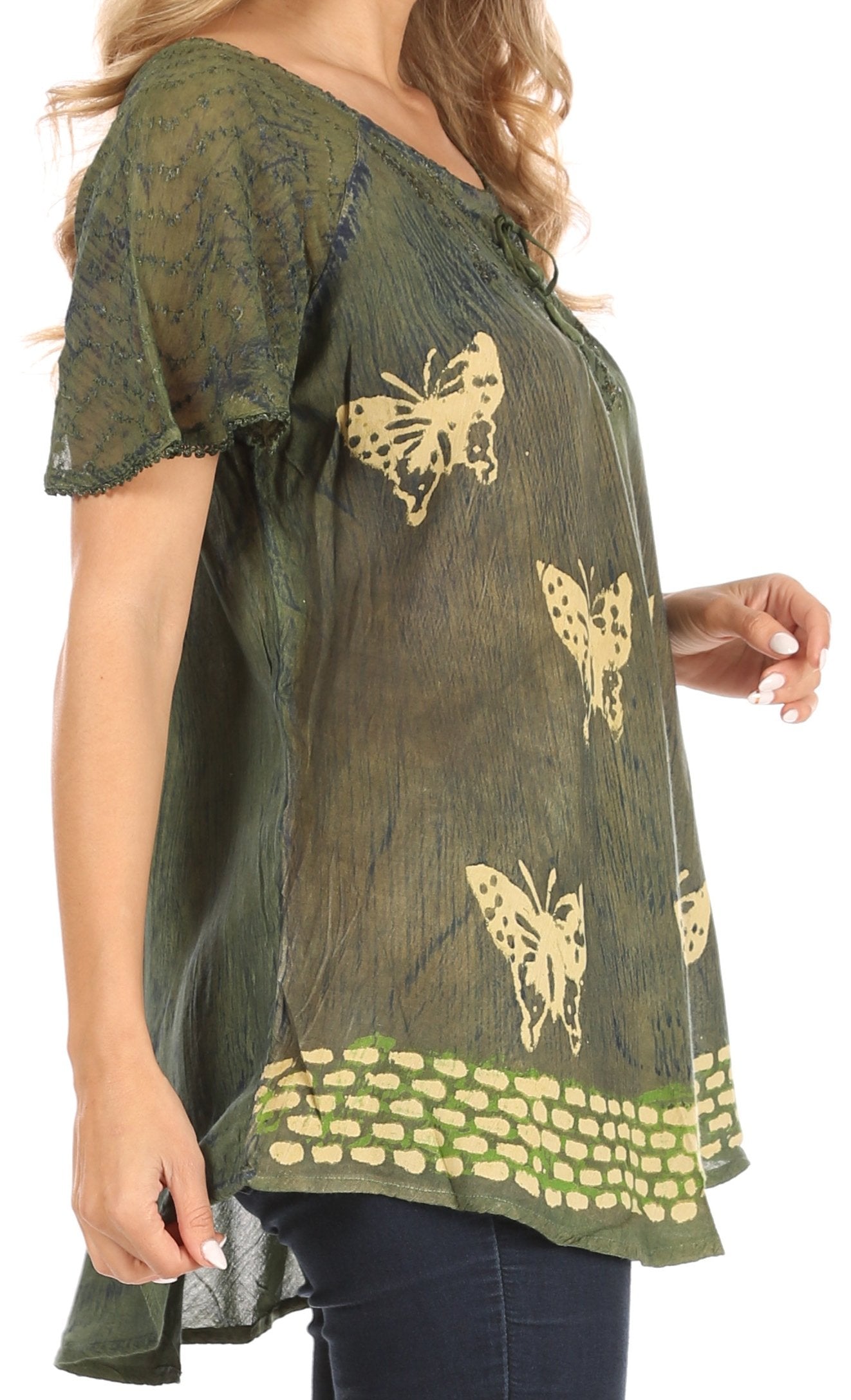 Green blouse with butterfly patterns worn by a person