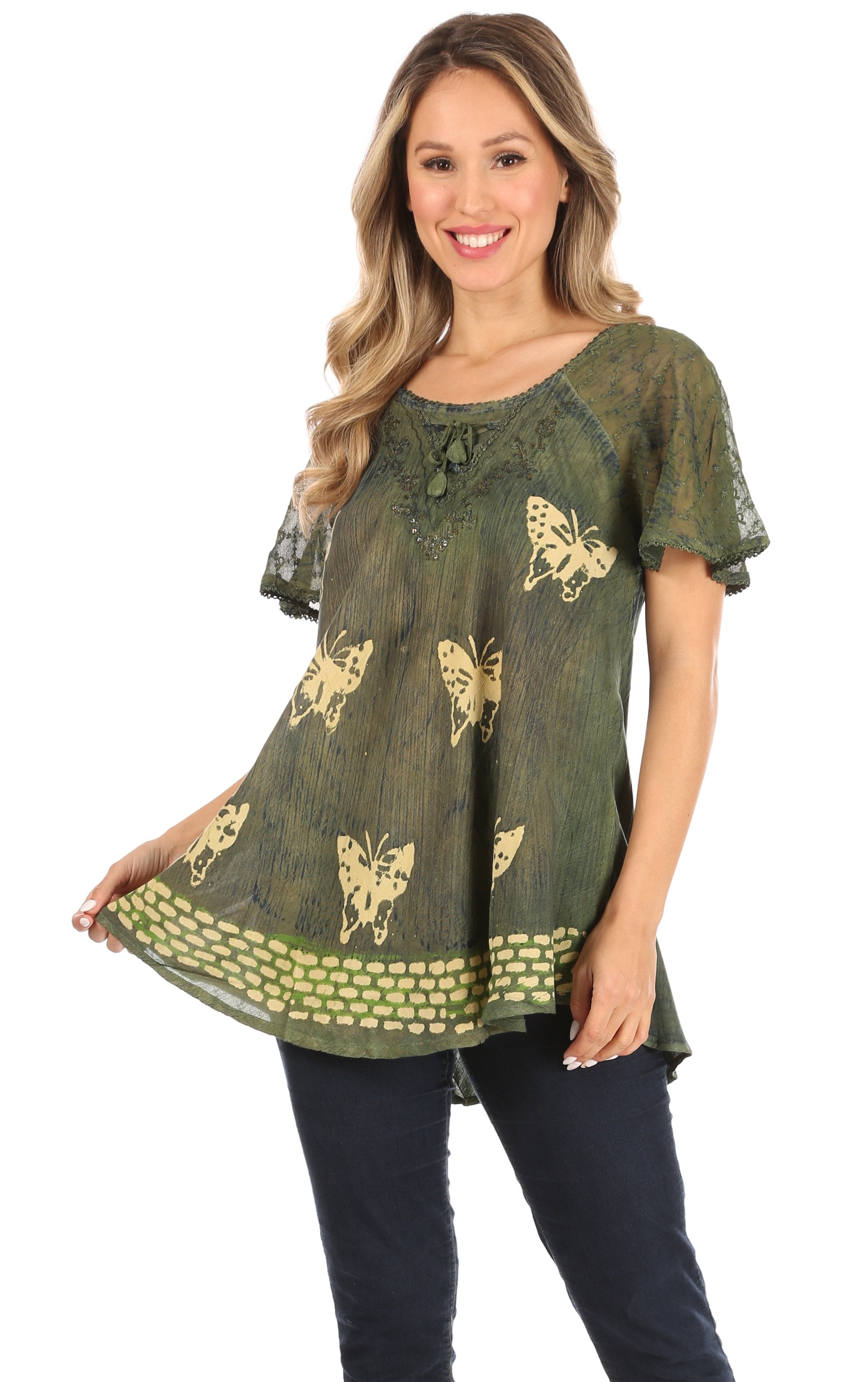 Woman wearing a green blouse with butterfly patterns on a white background