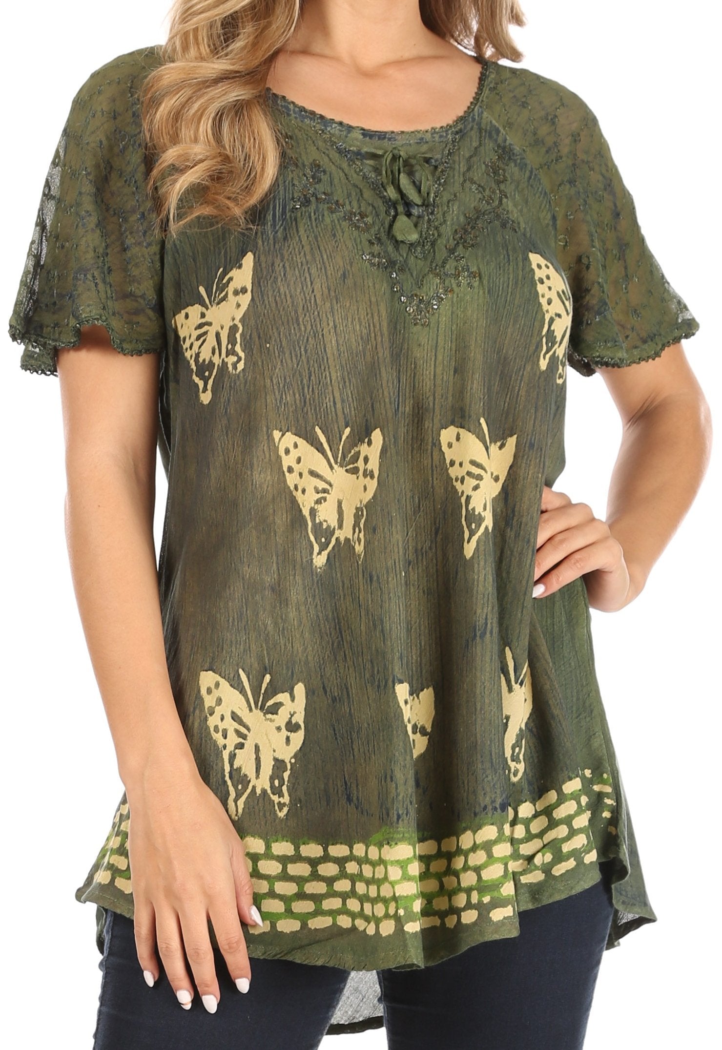 Green blouse with butterfly patterns worn by a person on a white background
