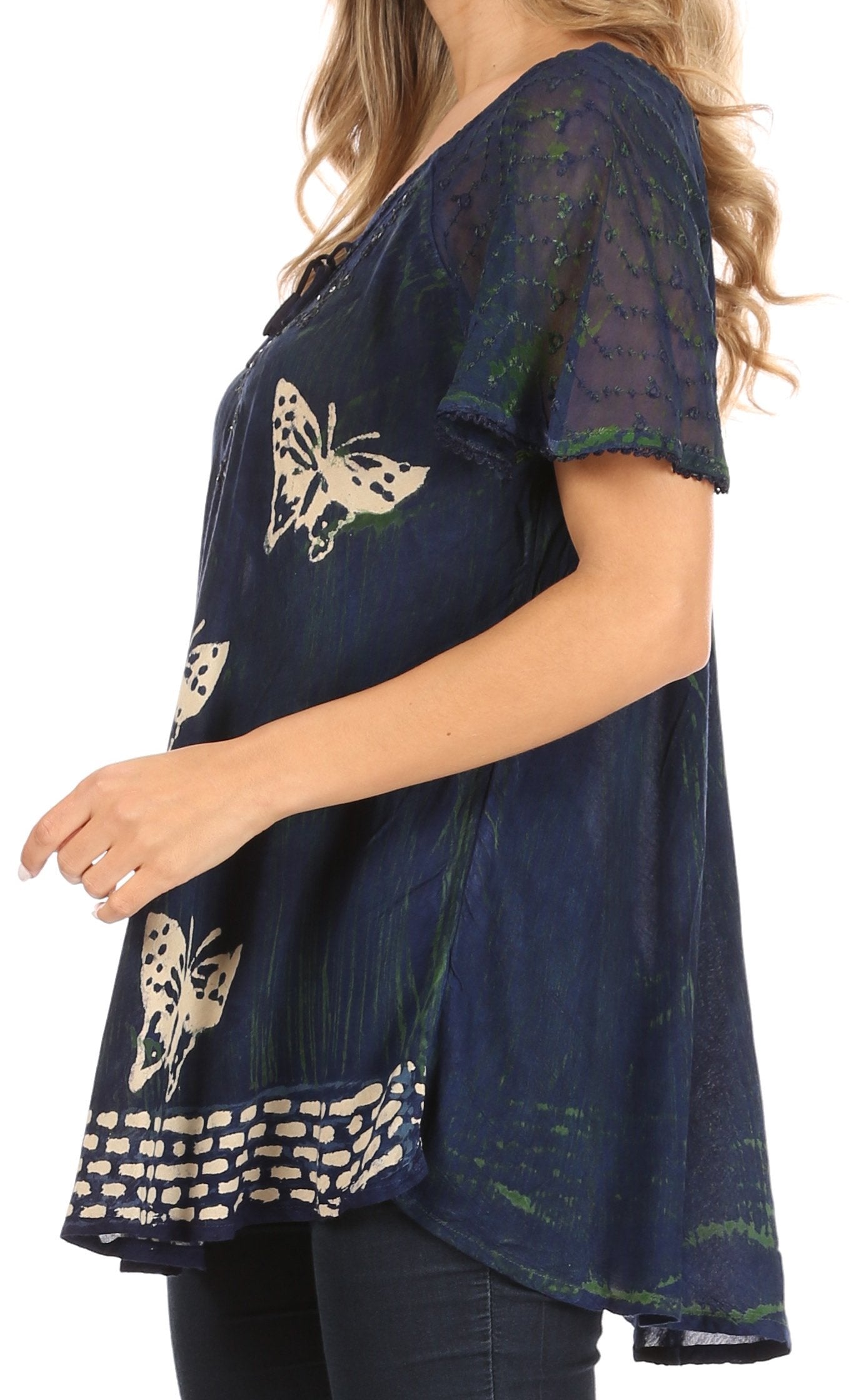 Navy blue top with butterfly designs worn by a person on a white background