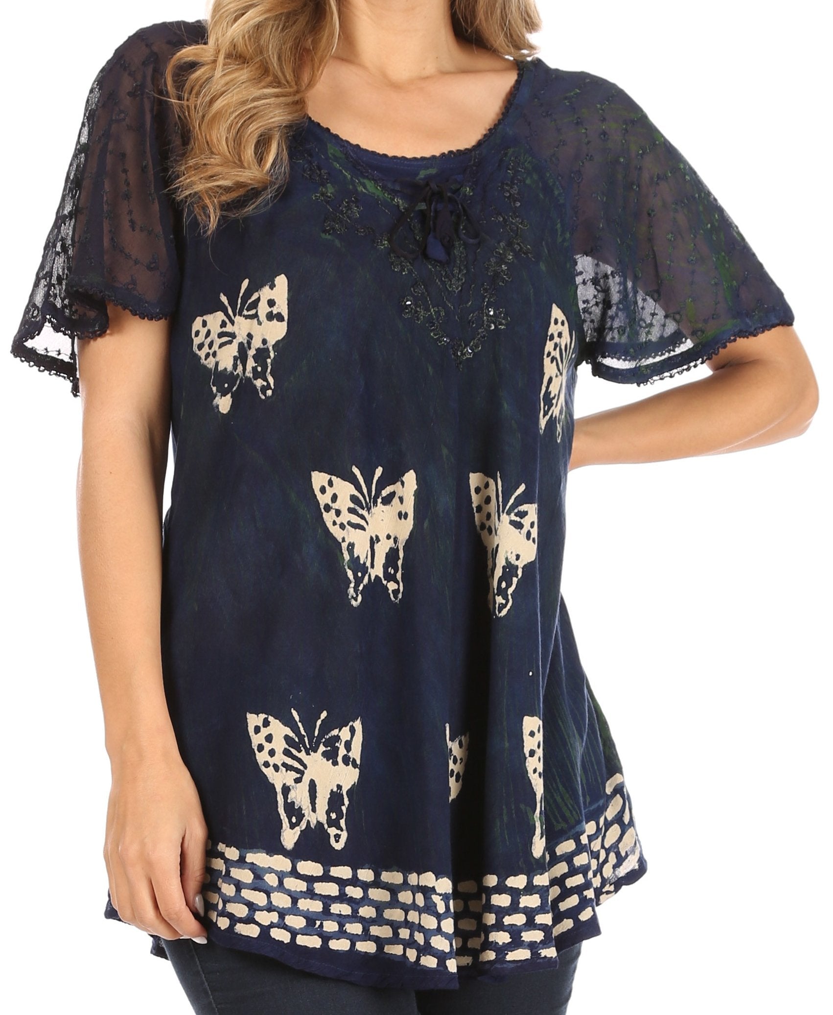 Navy blue blouse with butterfly patterns worn by a person on a white background