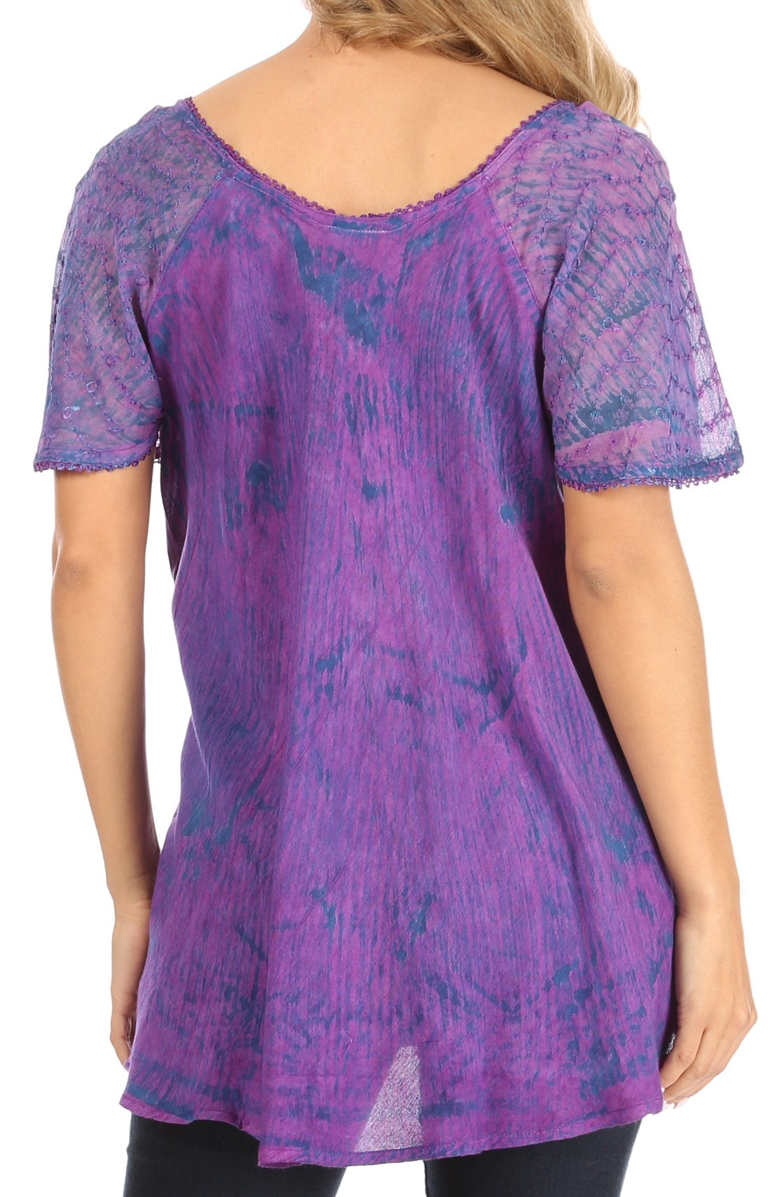 Purple patterned top worn by a person on a white background