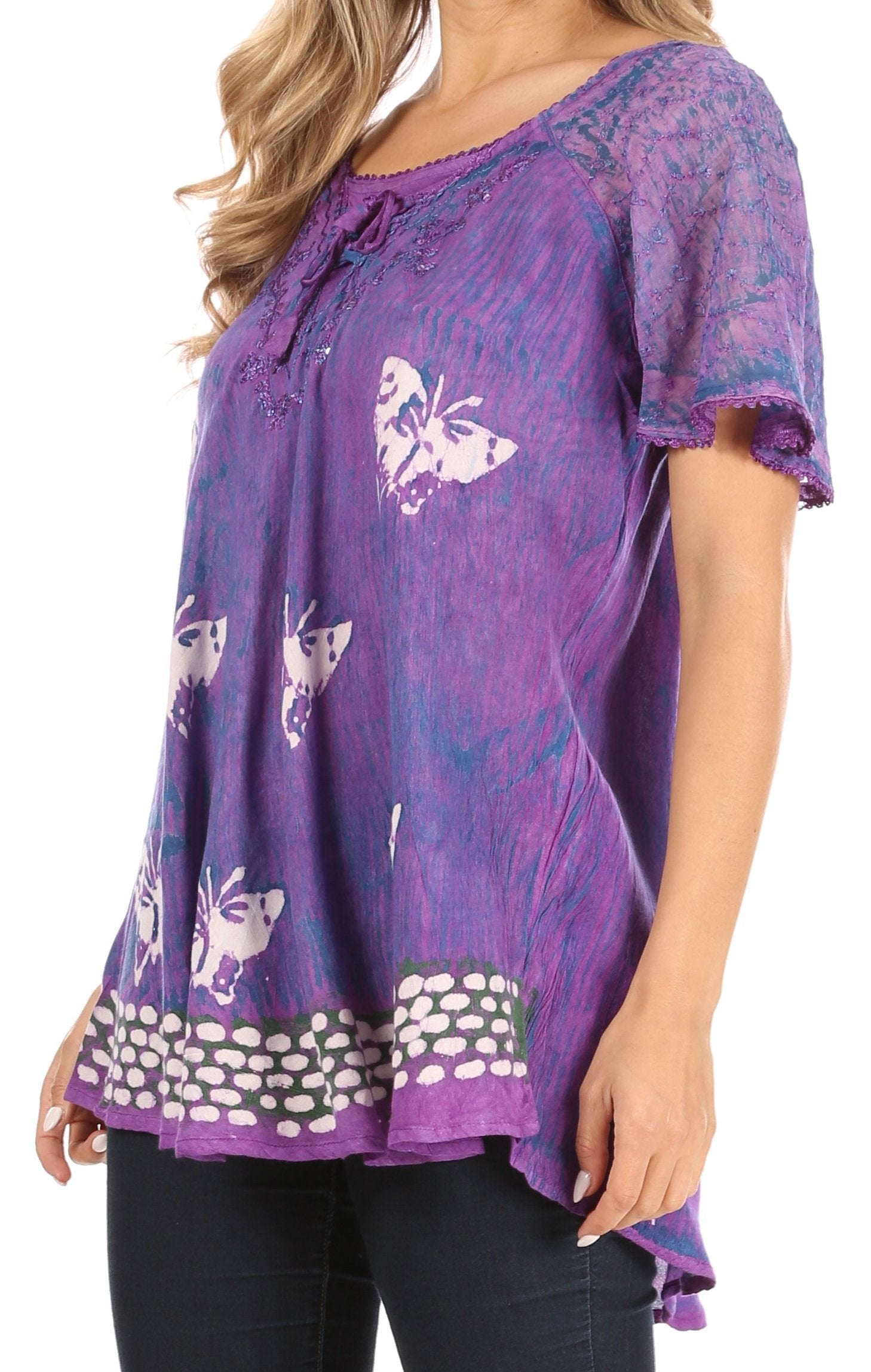 Purple blouse with butterfly pattern worn by a person on a white background