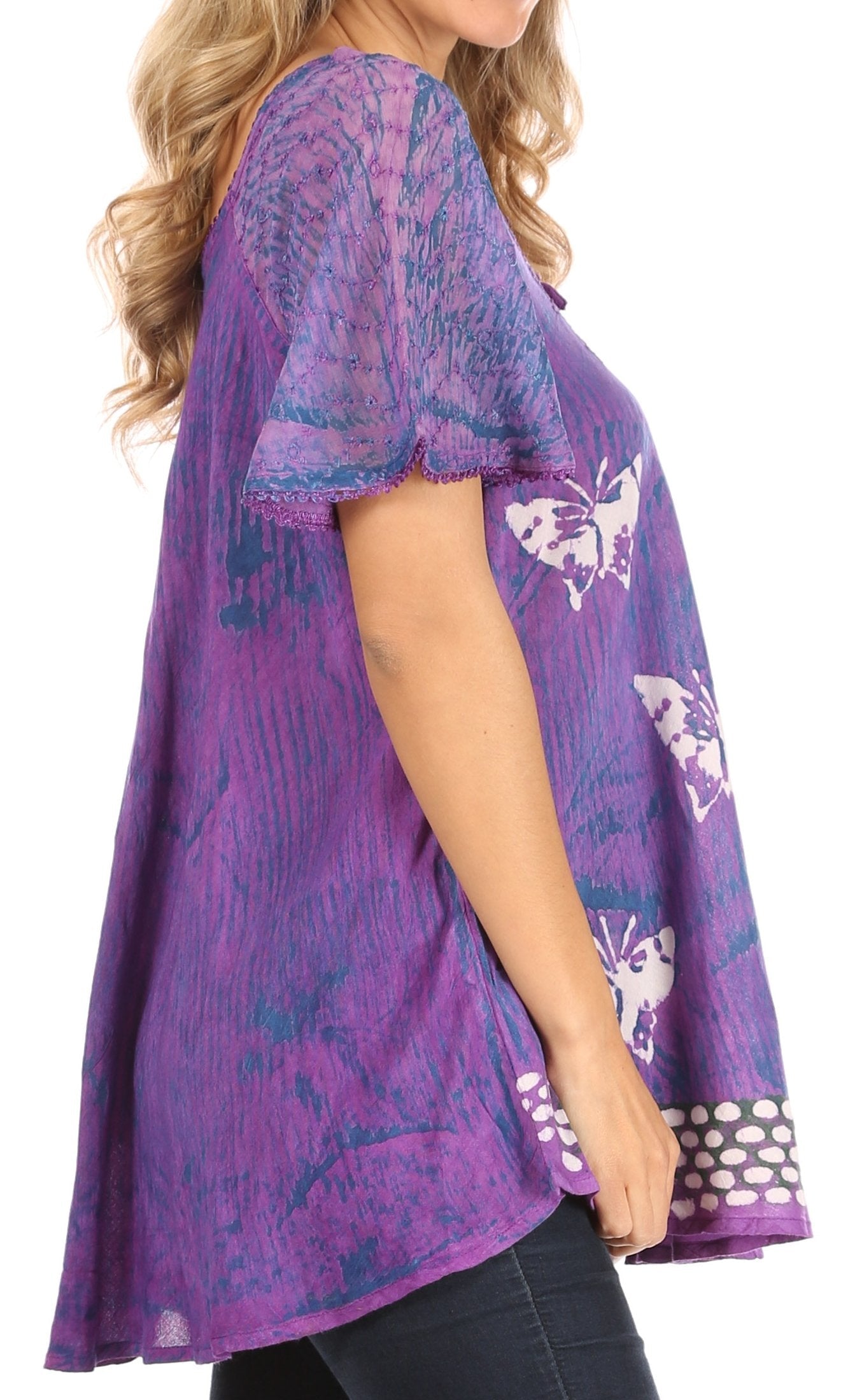 Purple patterned top worn by a person on a white background