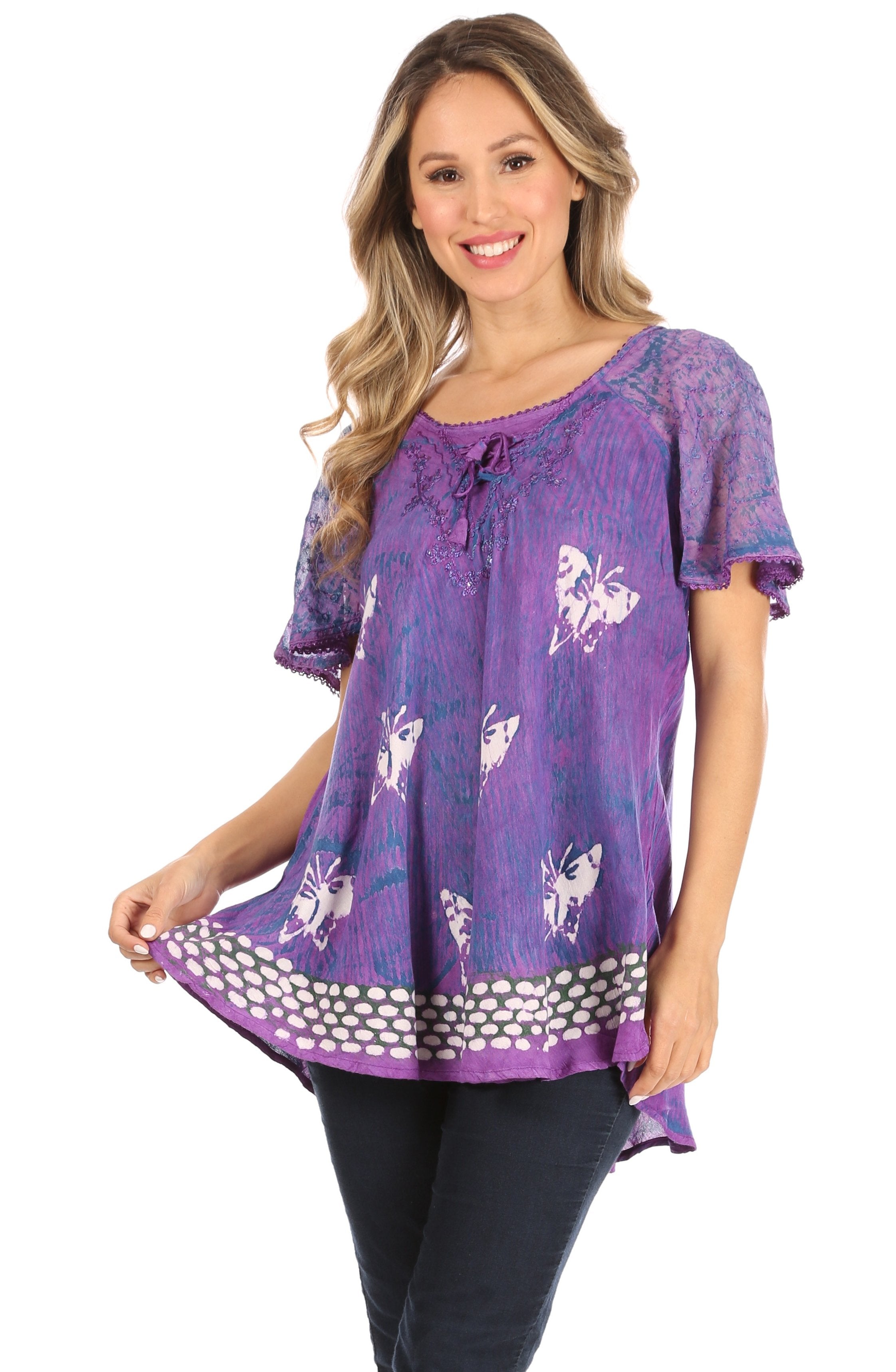 Woman wearing a purple patterned top on a white background
