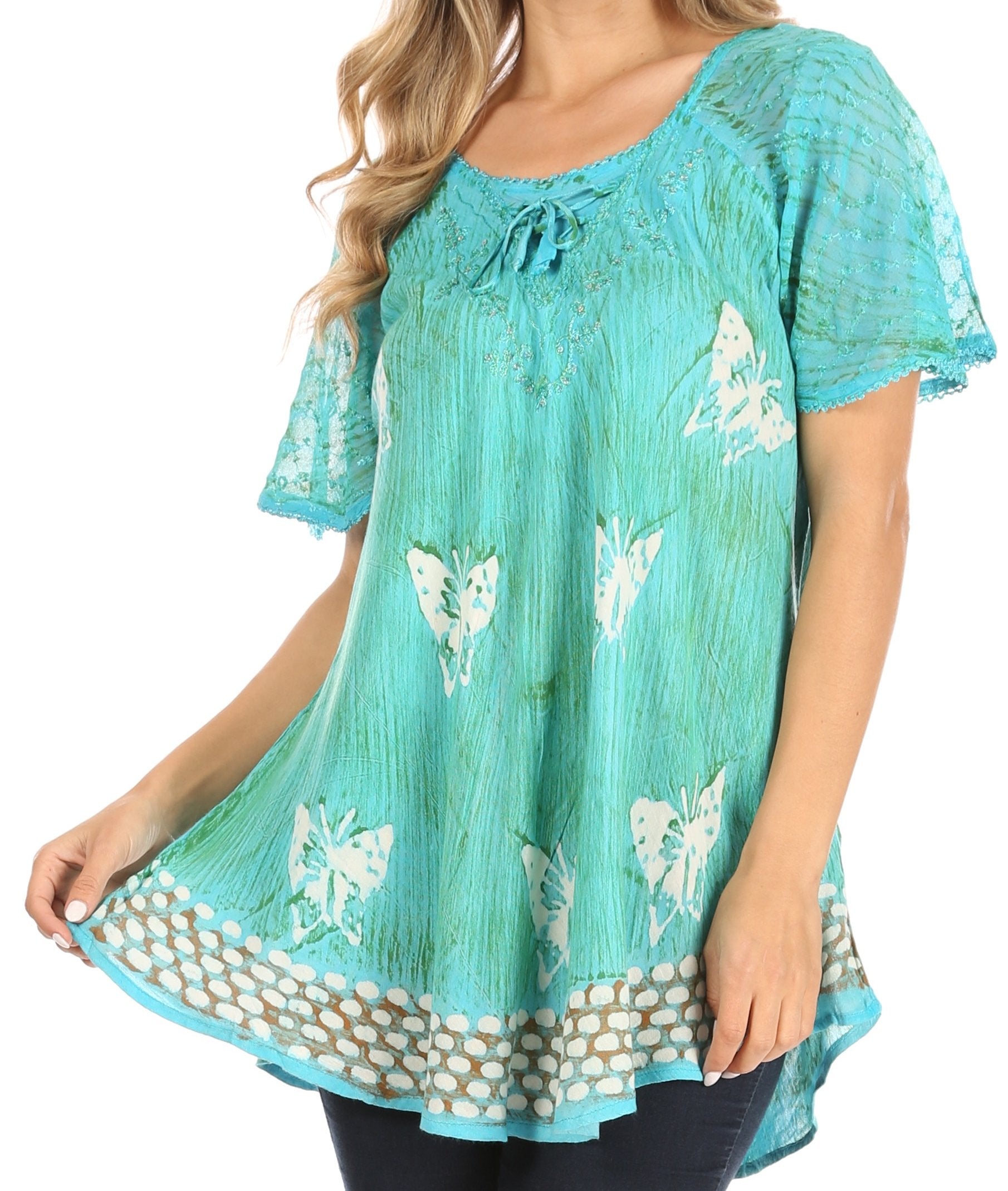 Turquoise blouse with butterfly pattern worn by a model on a white background