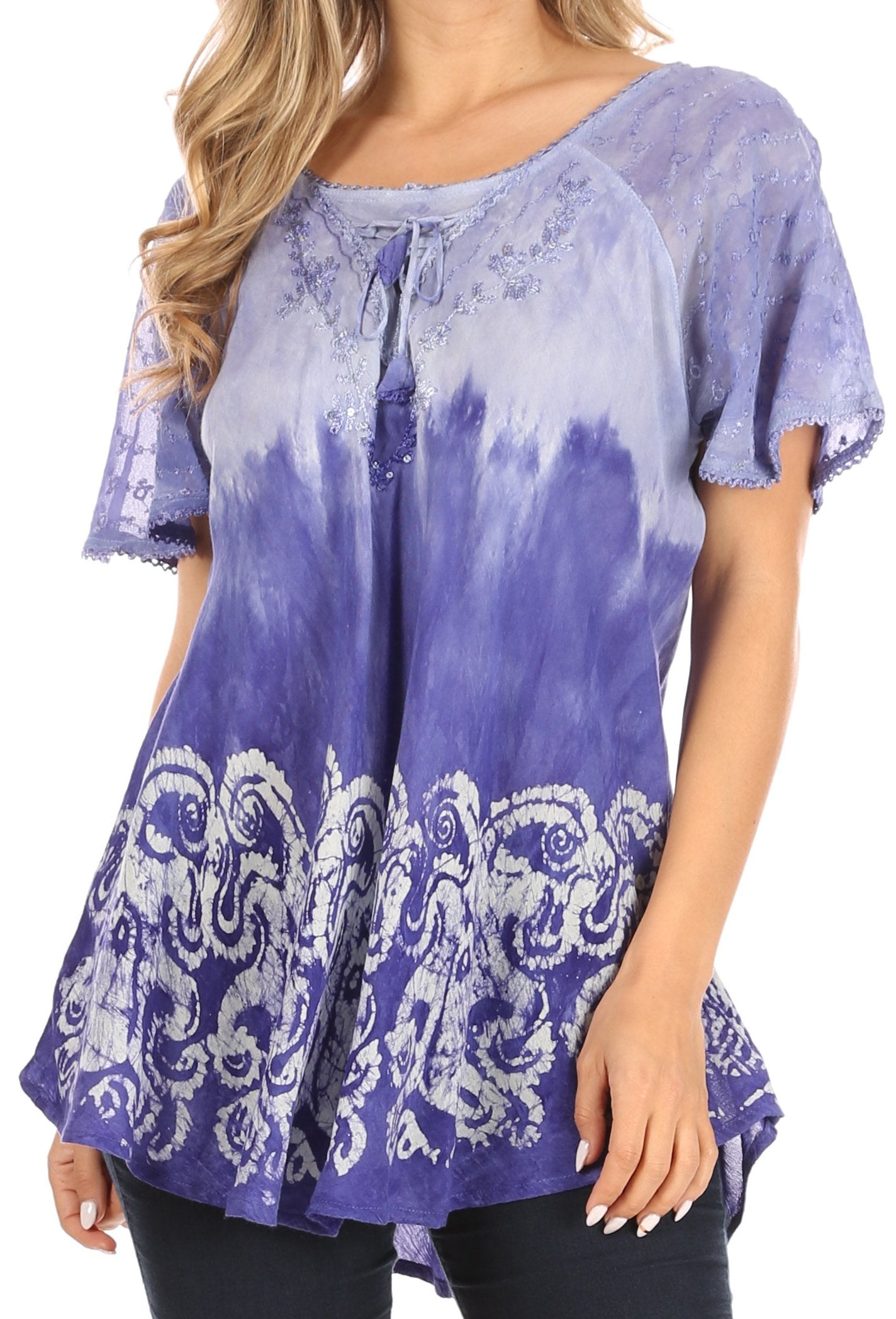 Purple tie-dye blouse with white patterns worn by a person