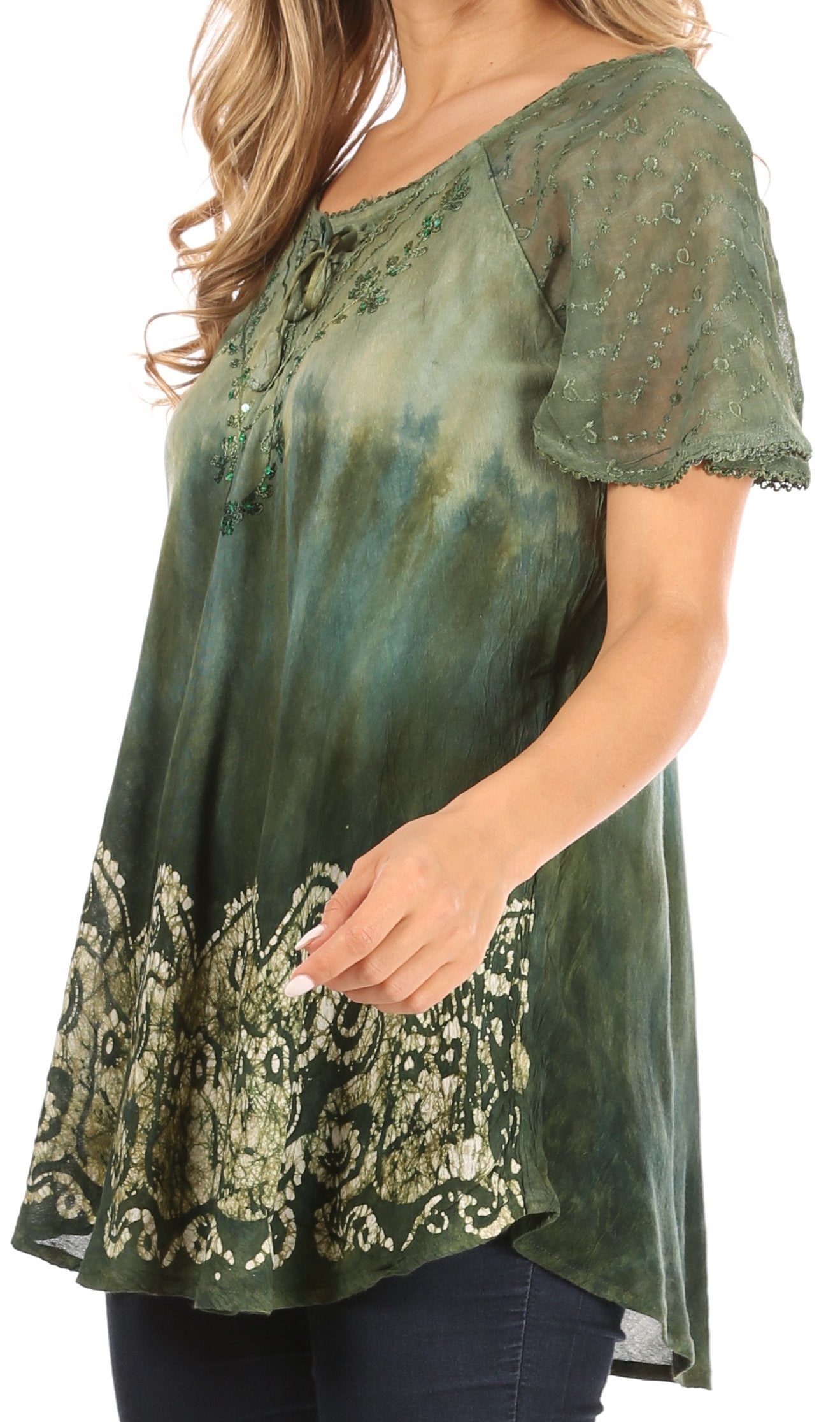 Green tie-dye blouse with lace details on a white background