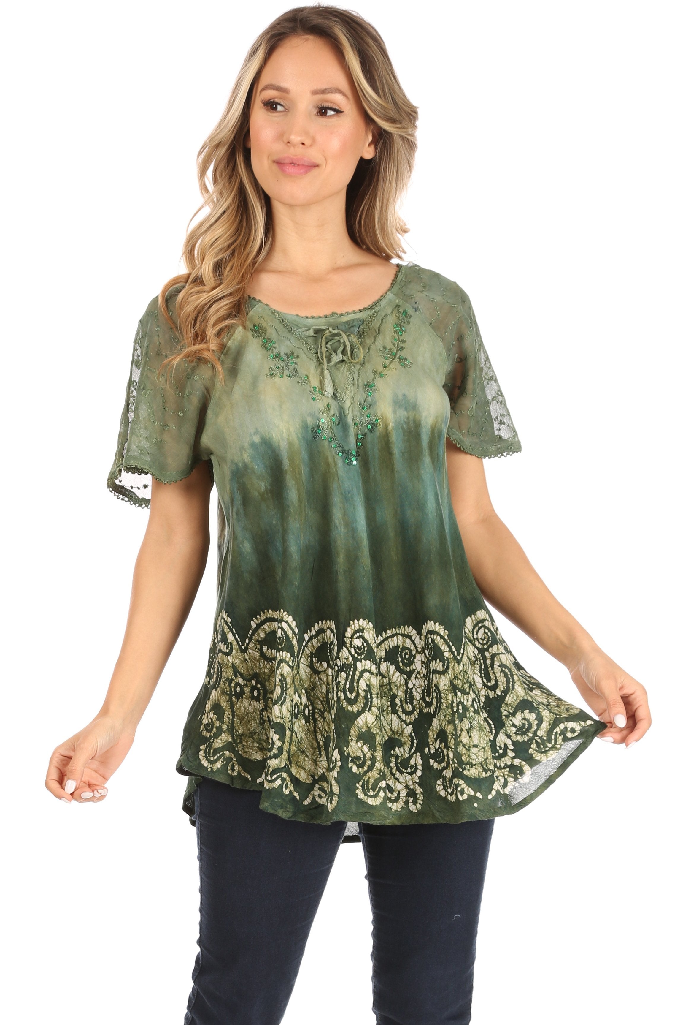 Woman wearing a green tie-dye top with lace details on a white background