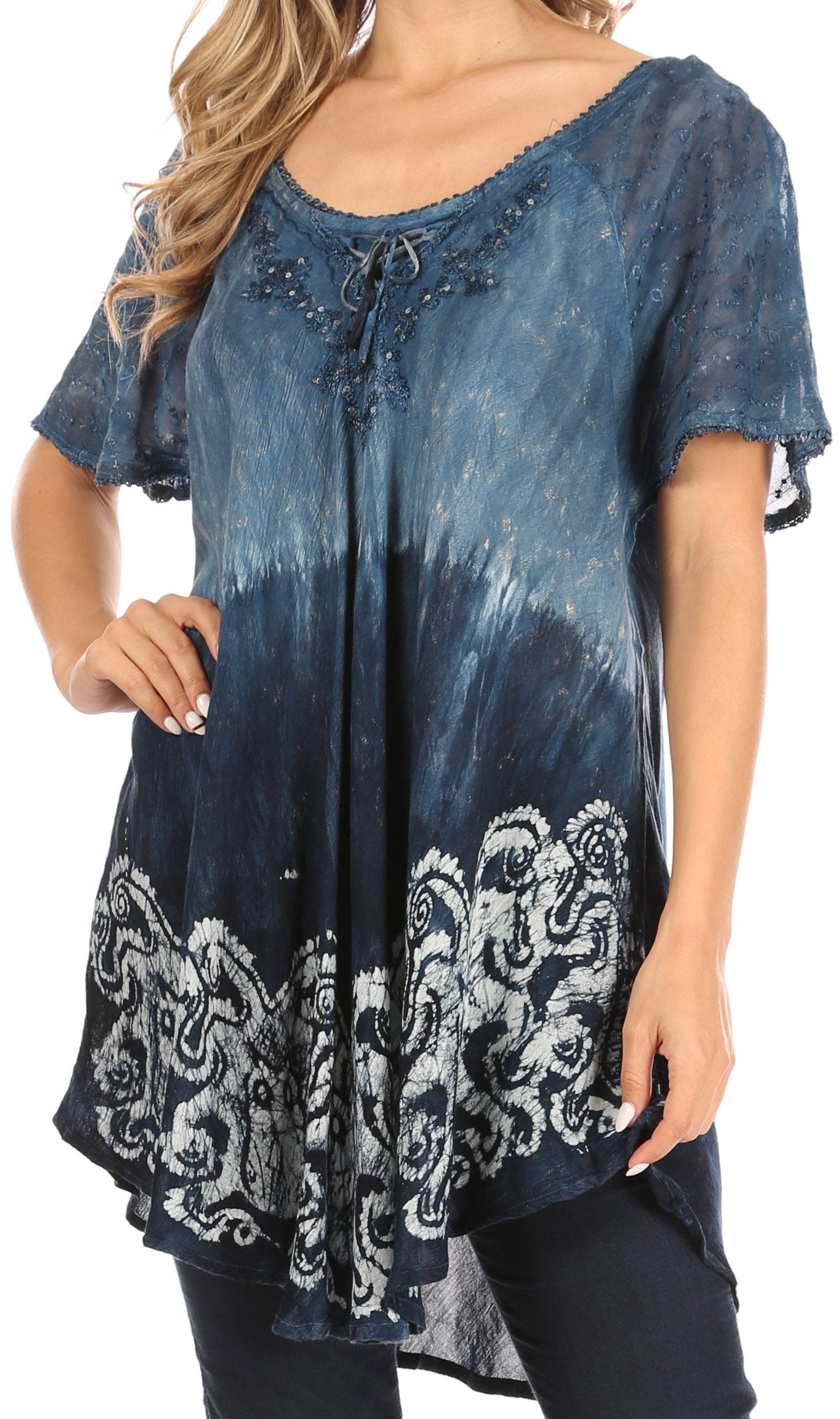 Blue tie-dye tunic with lace-up front and patterned hem on a white background