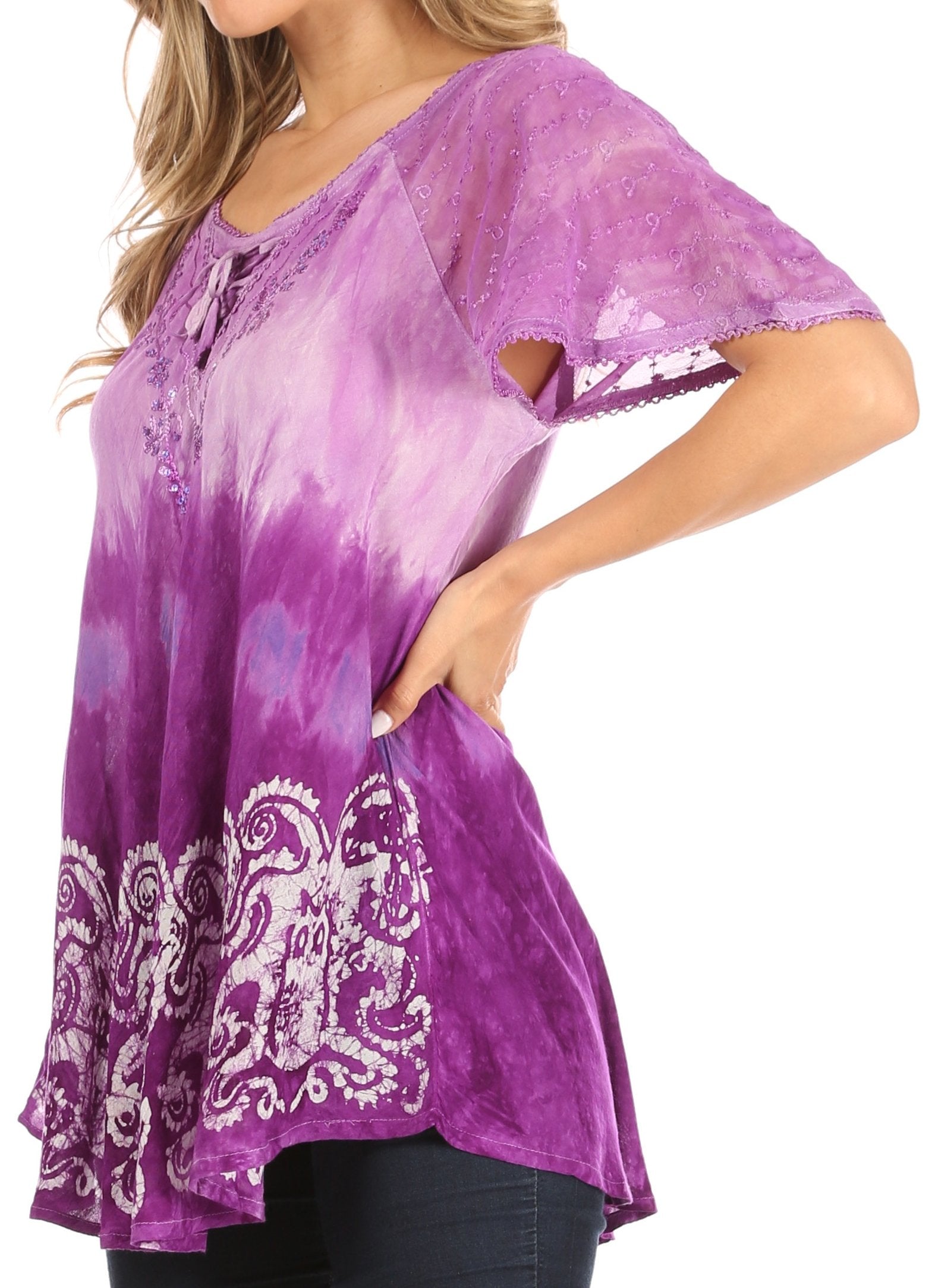 Purple tie-dye top with white patterns on a white background