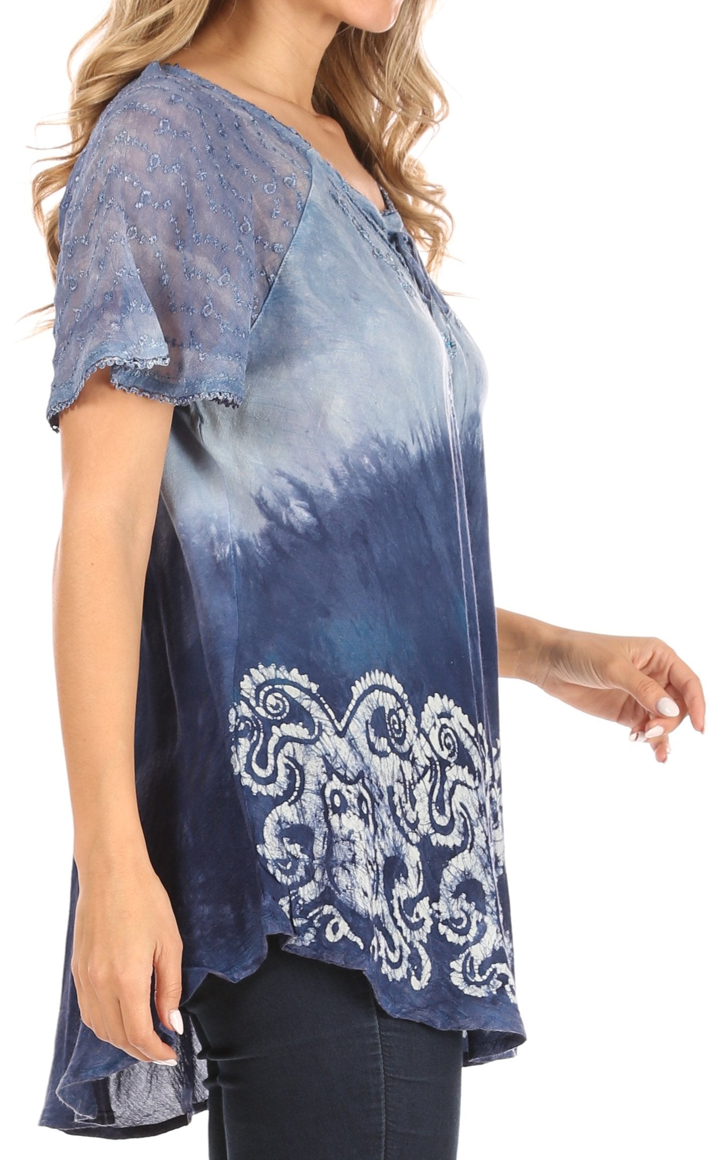 Blue tie-dye blouse with lace details on a white background