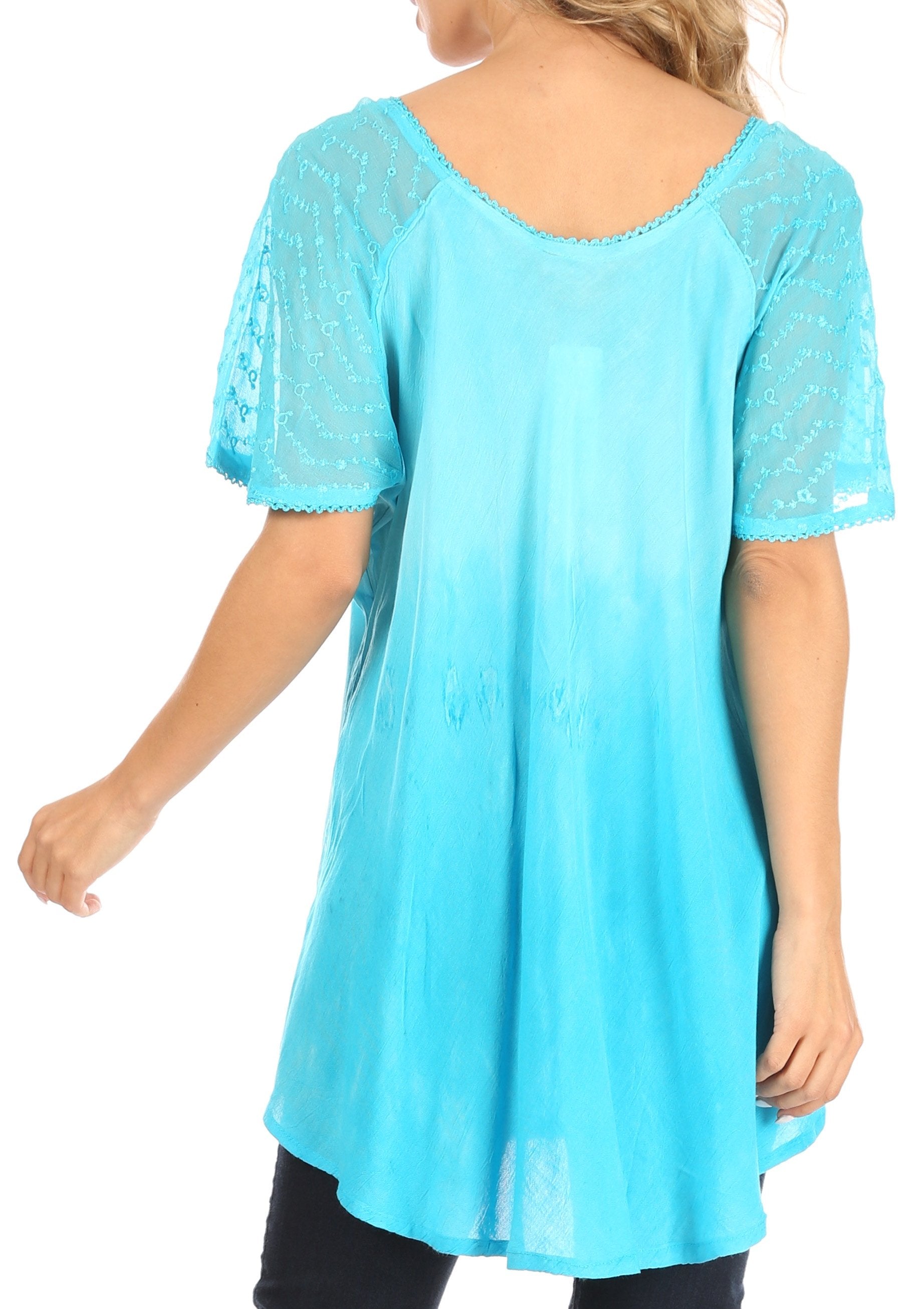 Light blue lace-trimmed top worn by a person on a white background