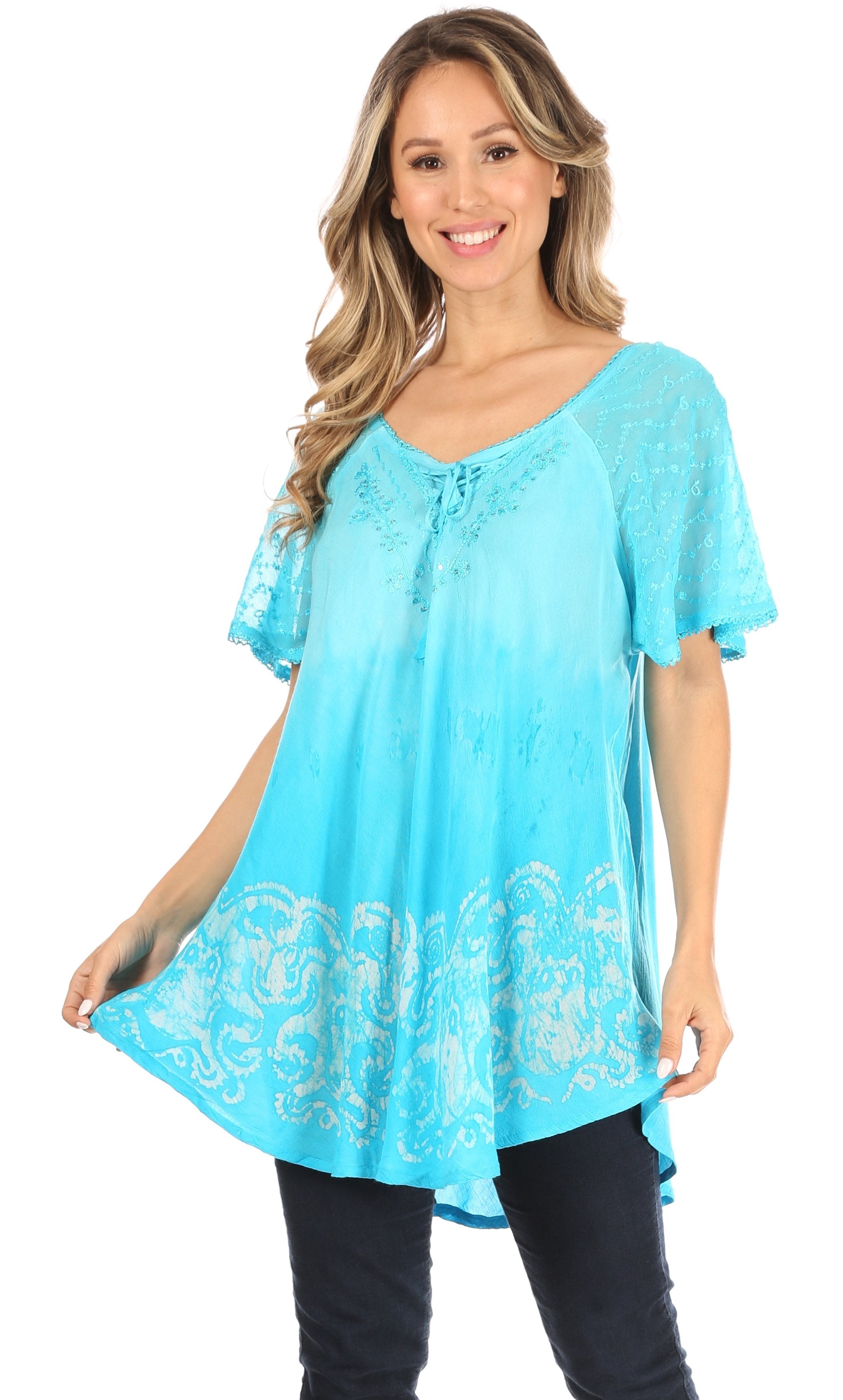 Woman wearing a turquoise lace-up top with a white background