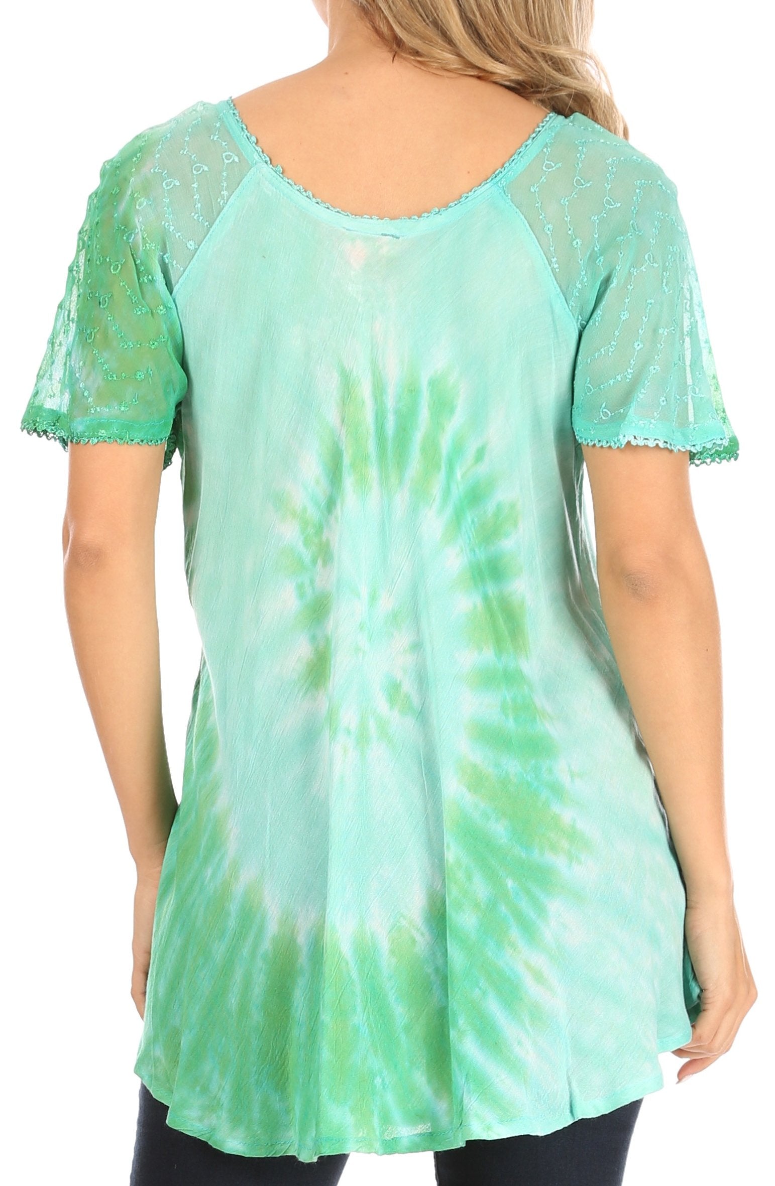 Green tie-dye tunic with sheer sleeves worn by a person on a white background