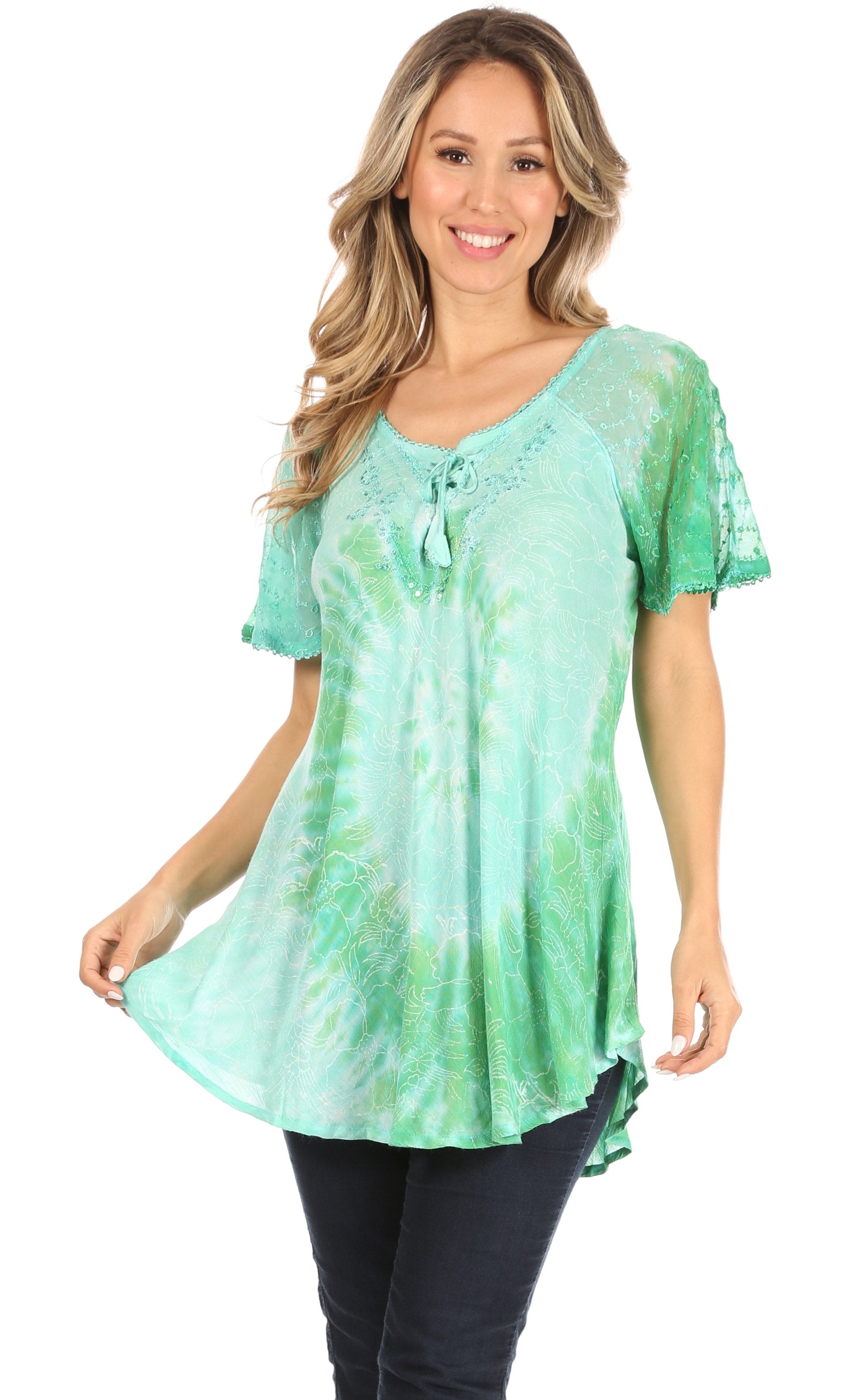 Woman wearing a green tie-dye top on a white background