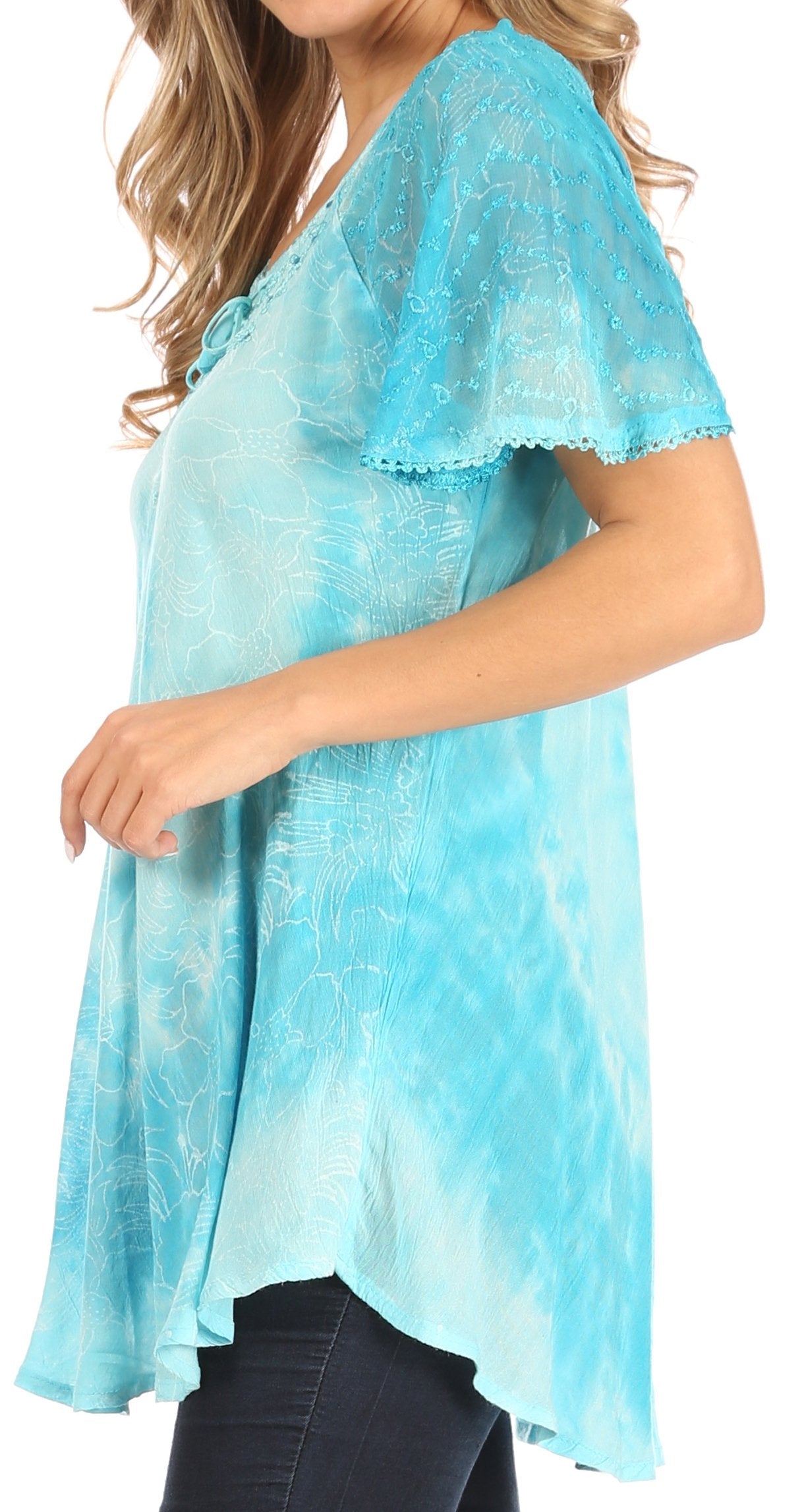 Light blue lace top worn by a person on a white background