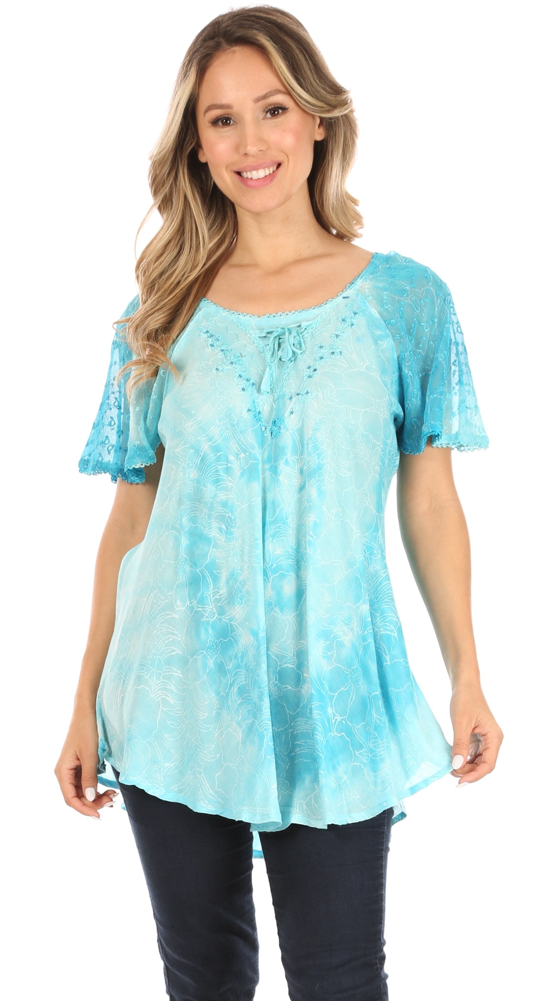 Woman wearing a light blue tie-dye top on a white background