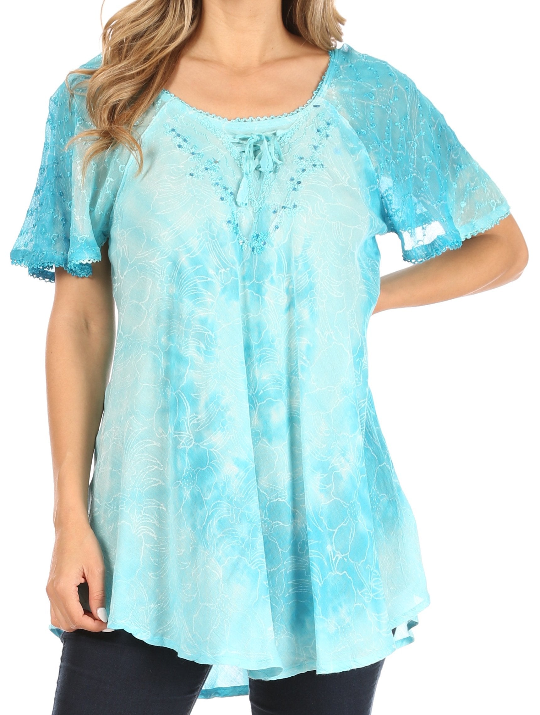 Woman wearing a light blue tie-dye blouse on a white background