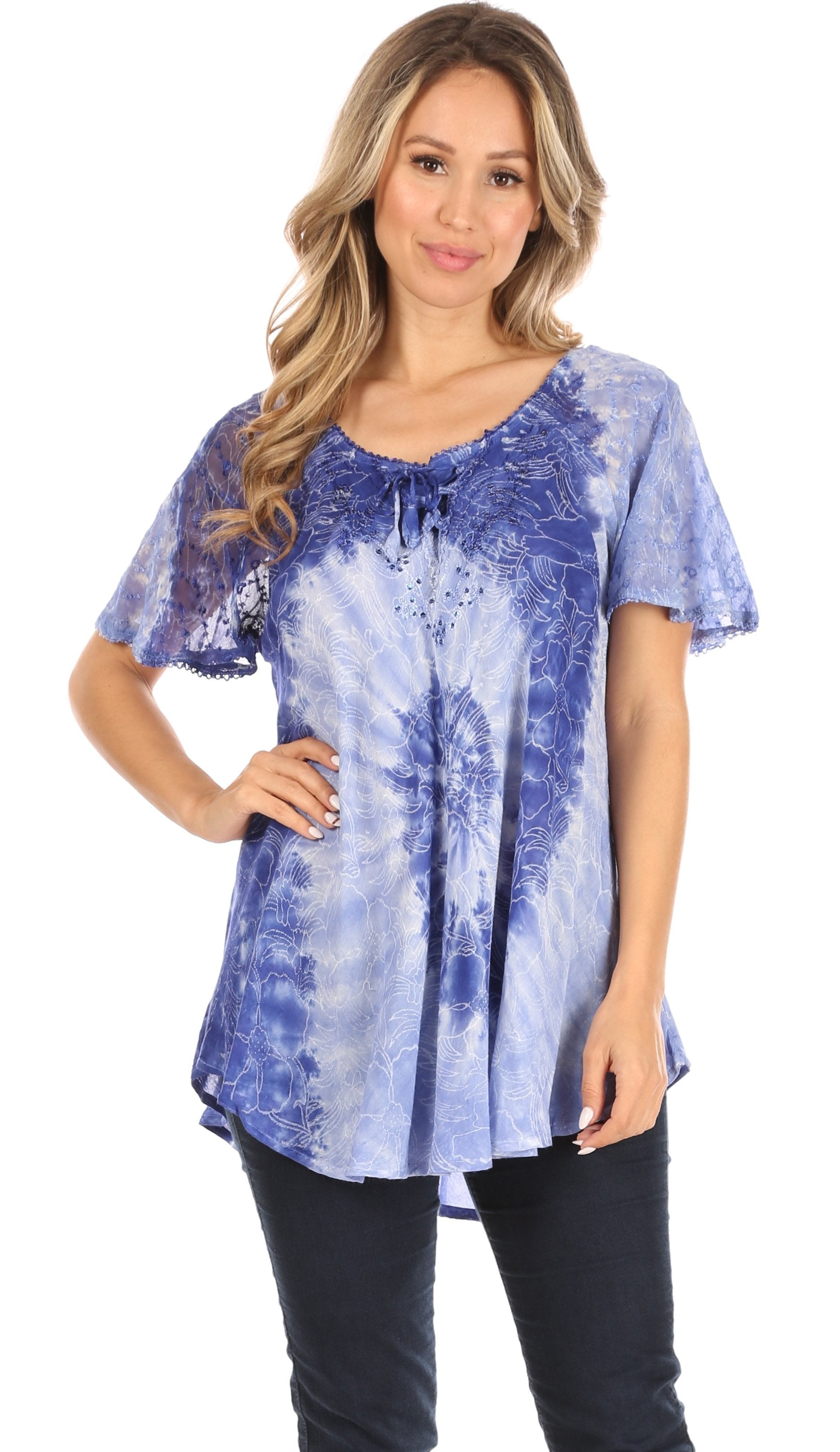 Woman wearing a blue and white patterned top on a white background