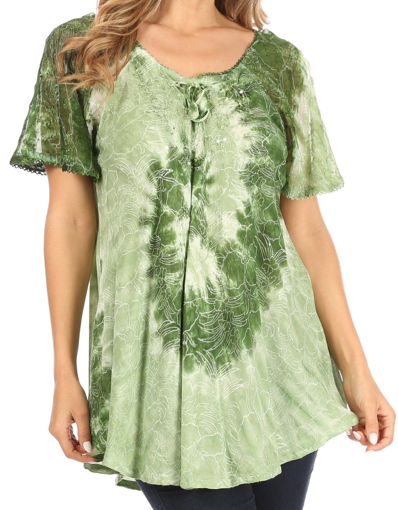 Green patterned blouse worn by a person on a white background