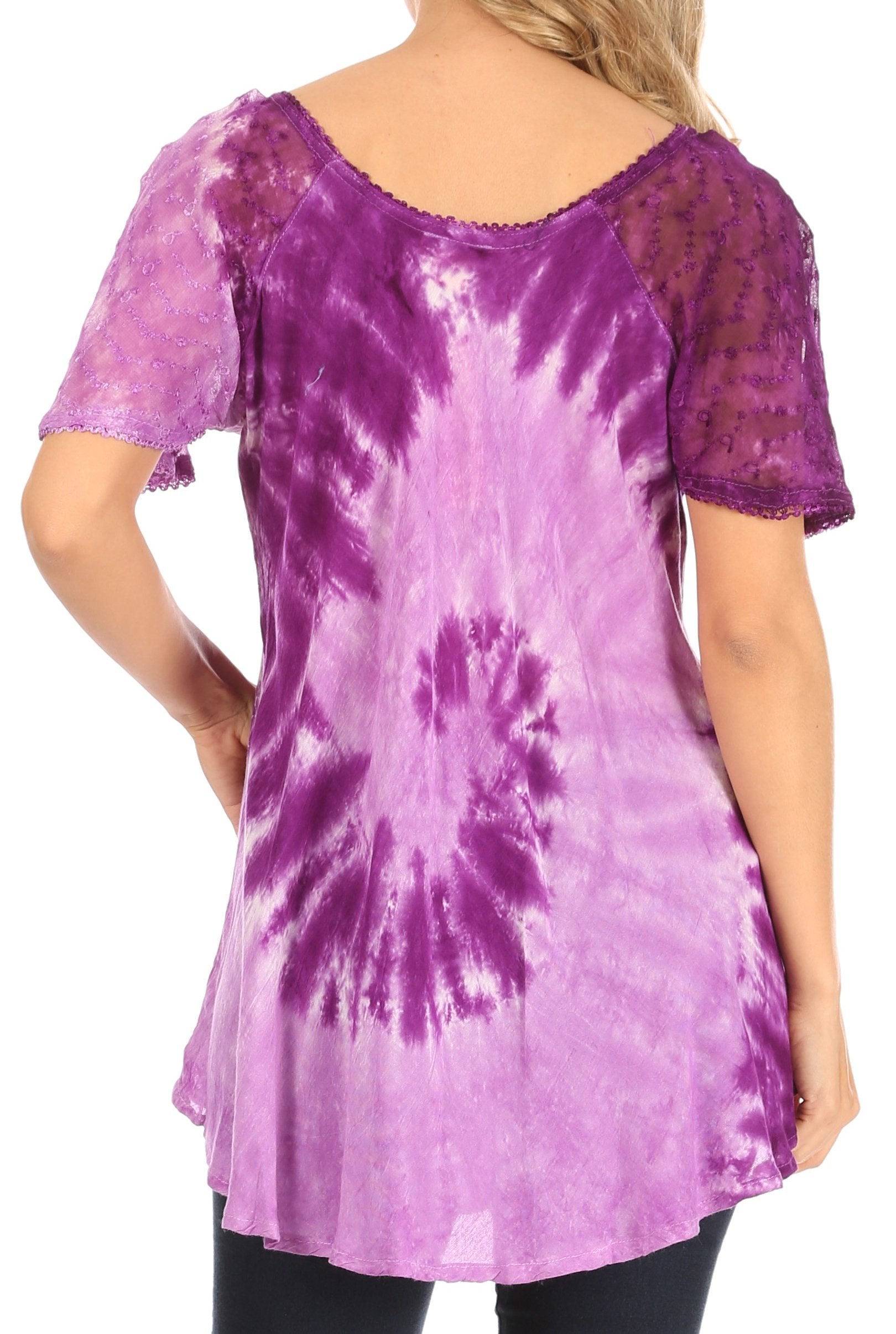 Purple tie-dye tunic with lace sleeves worn by a person on a white background