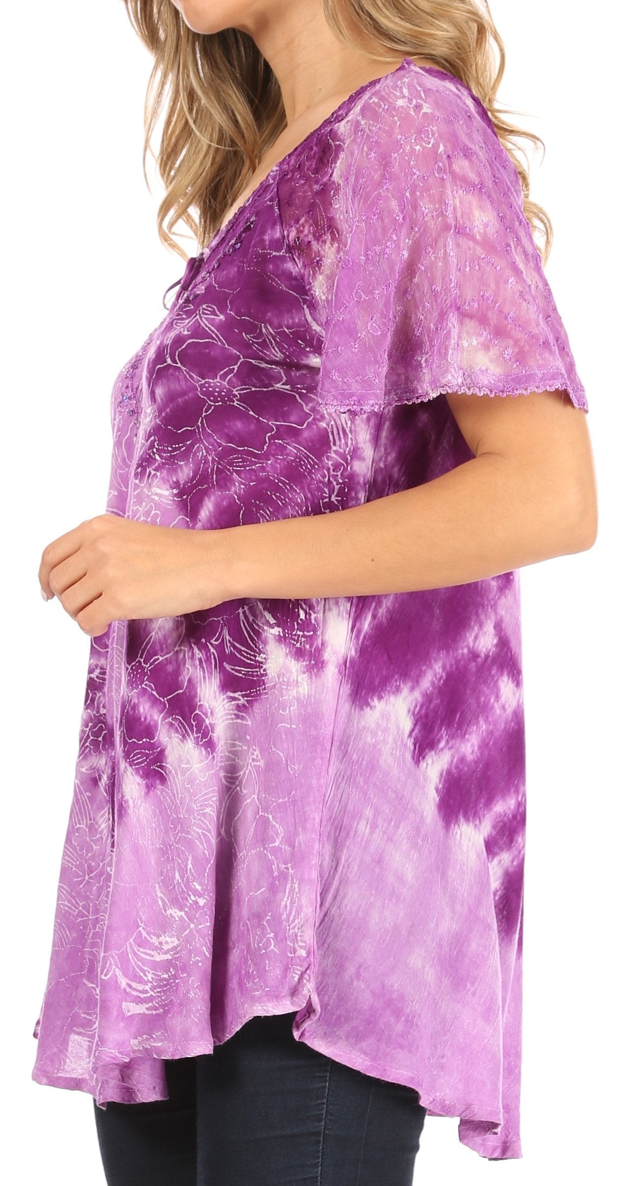 Purple tie-dye shirt worn by a person on a white background