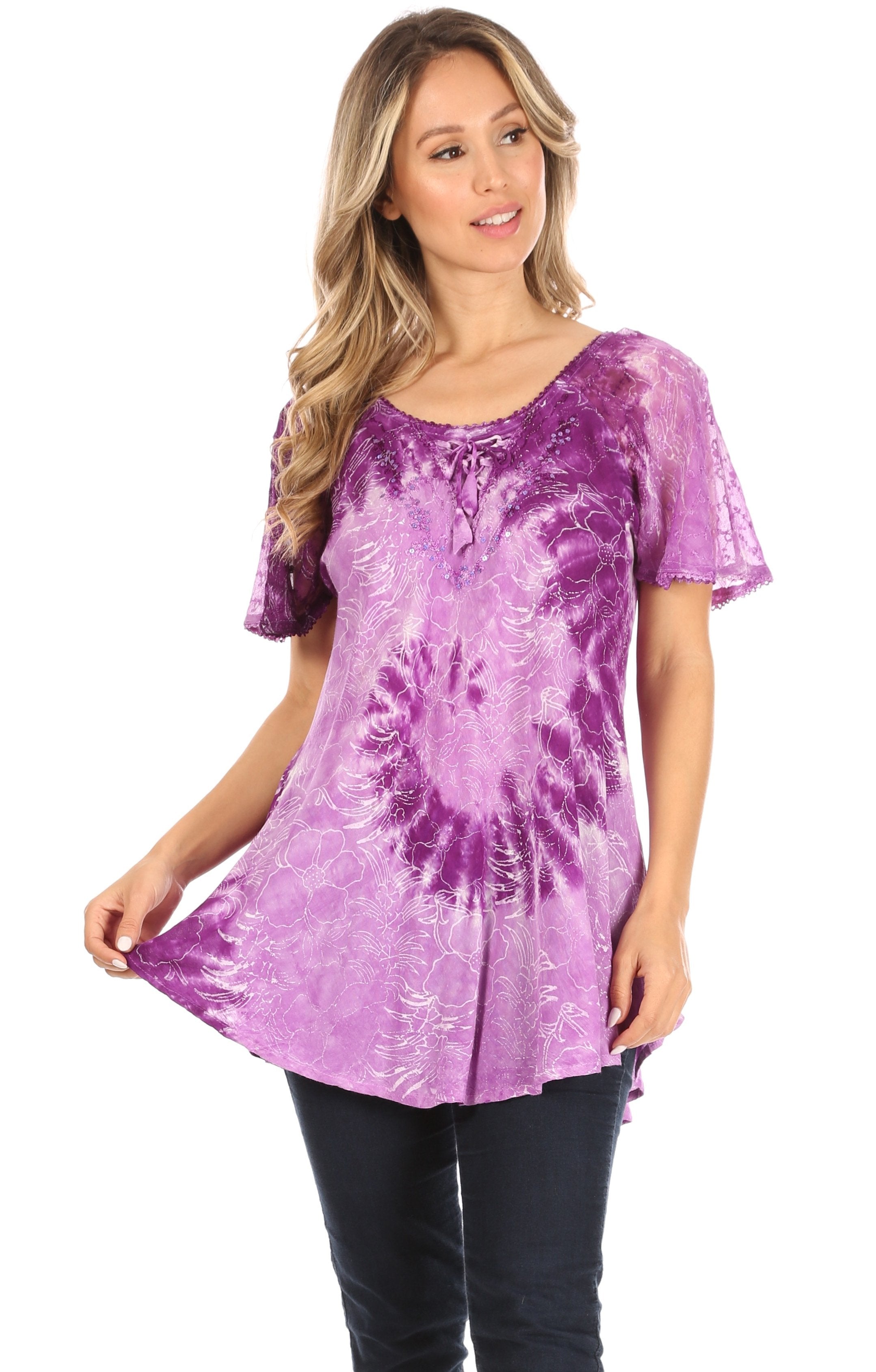 Woman wearing a purple tie-dye tunic on a white background