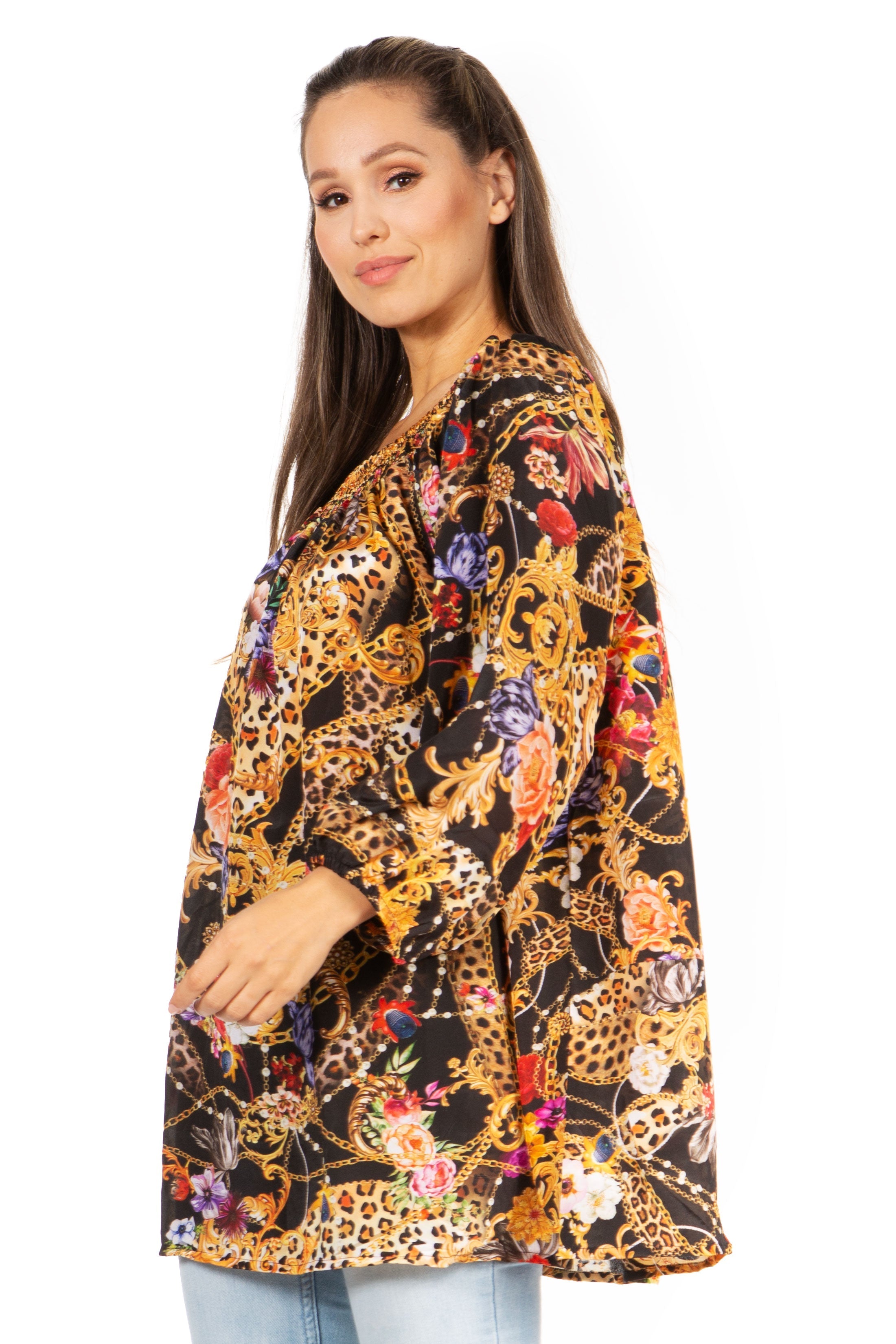 Woman wearing a colorful patterned kimono-style jacket on a white background