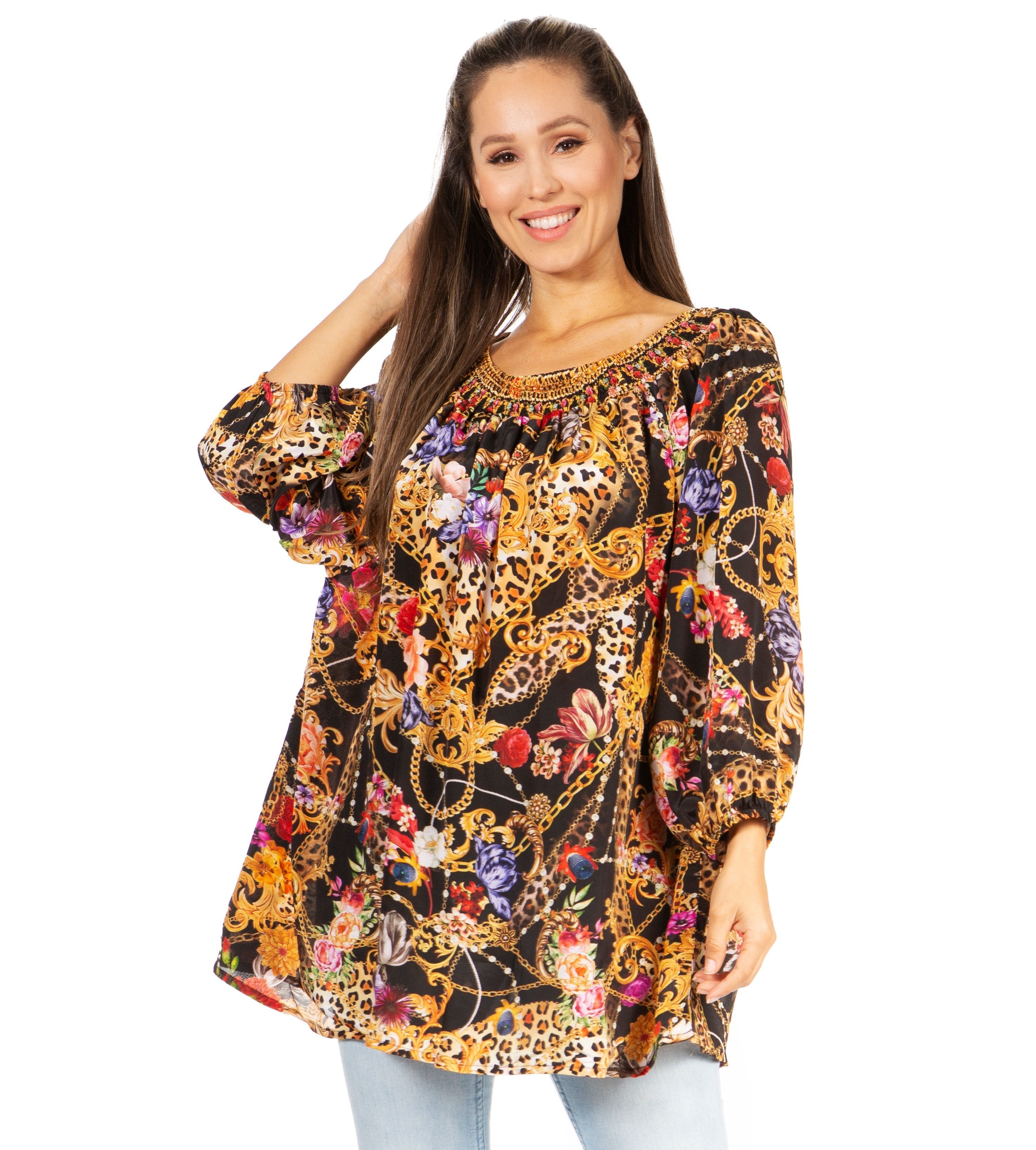 Woman wearing a colorful patterned blouse on a white background