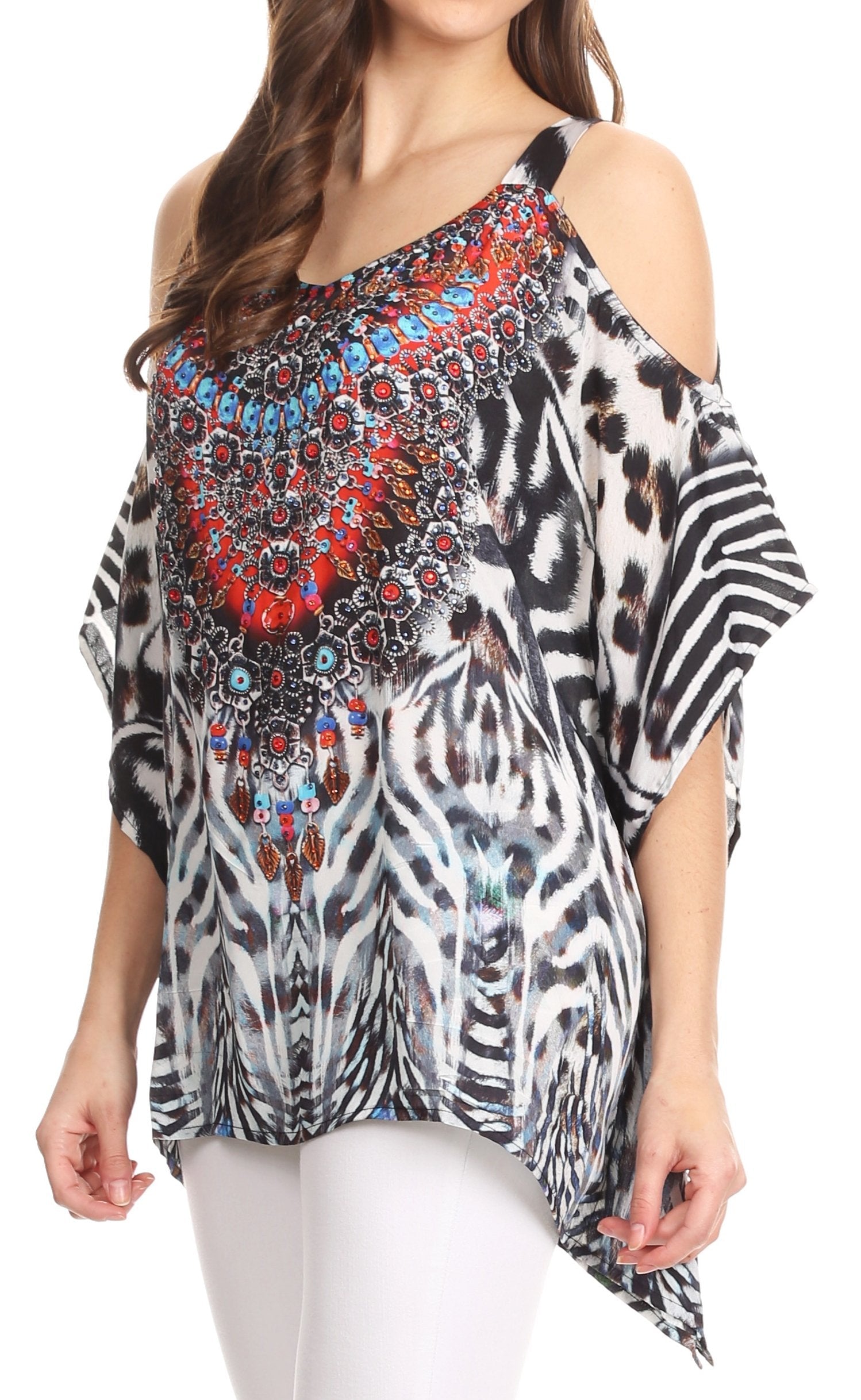 Woman wearing a colorful, patterned top with zebra and leopard print on a white background
