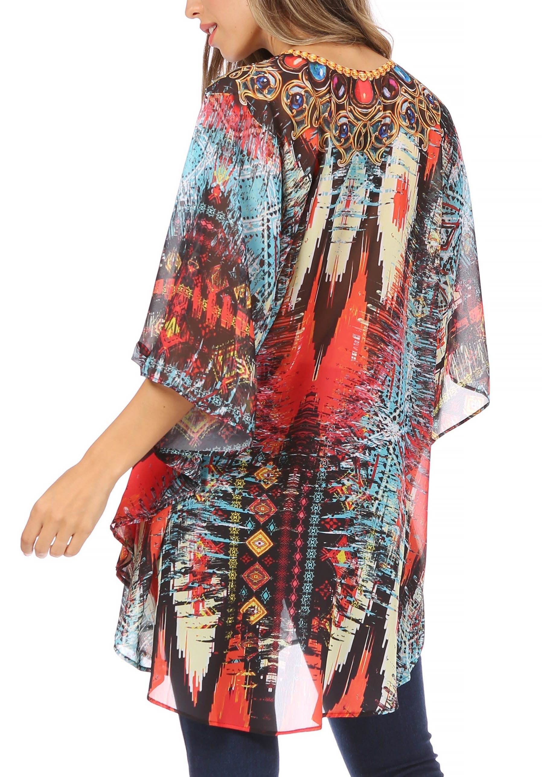 Colorful patterned kimono-style top worn by a person on a white background